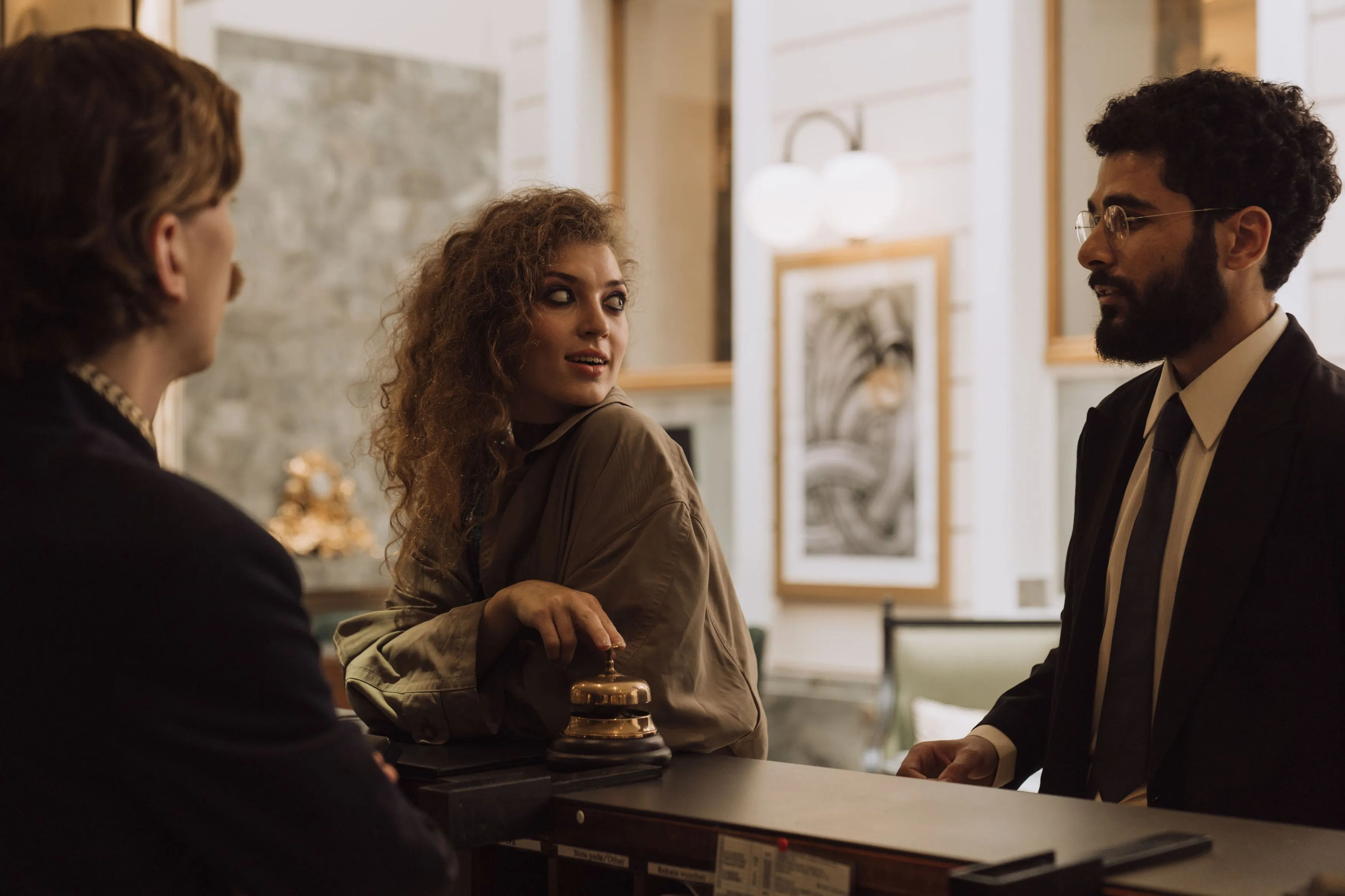 Guests being welcomed at a hotel front desk, the human moments that make a property a story