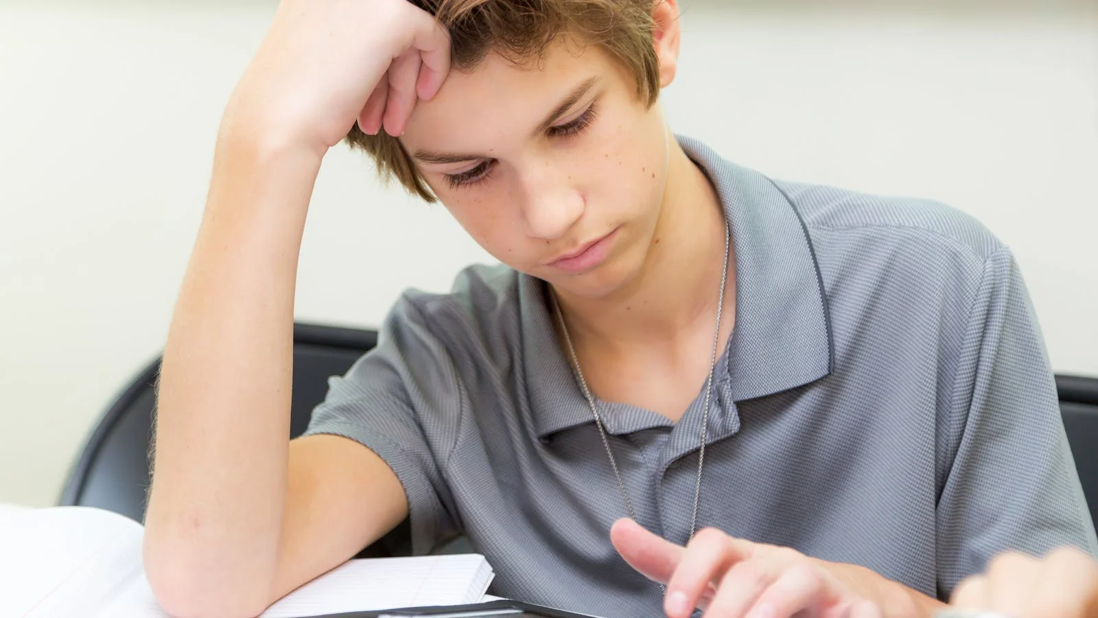 Teen student working through a lesson on a tablet, the search behavior EdTech brands need to map