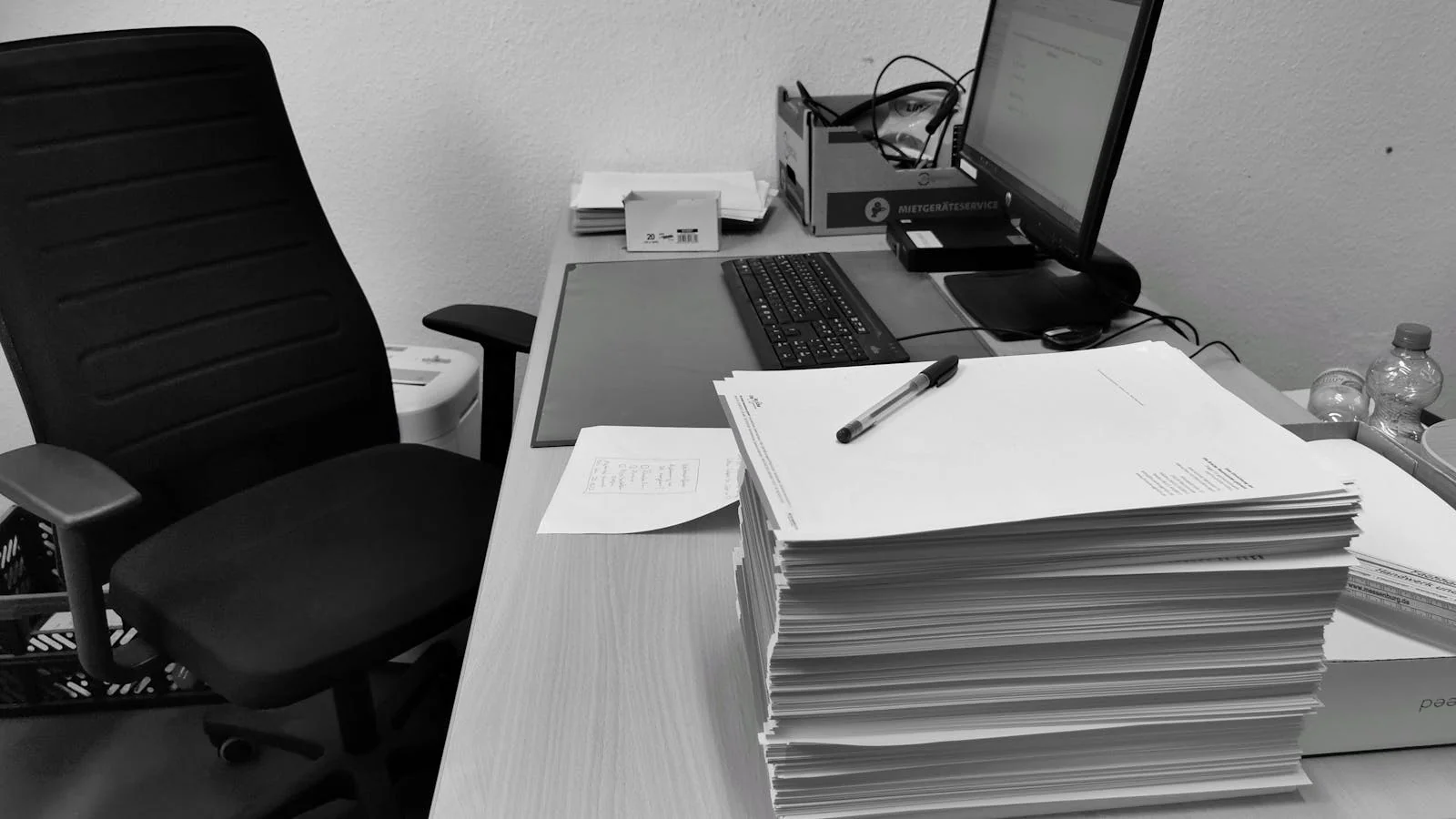 Admin office desk with paperwork and a computer where district vendor decisions actually happen