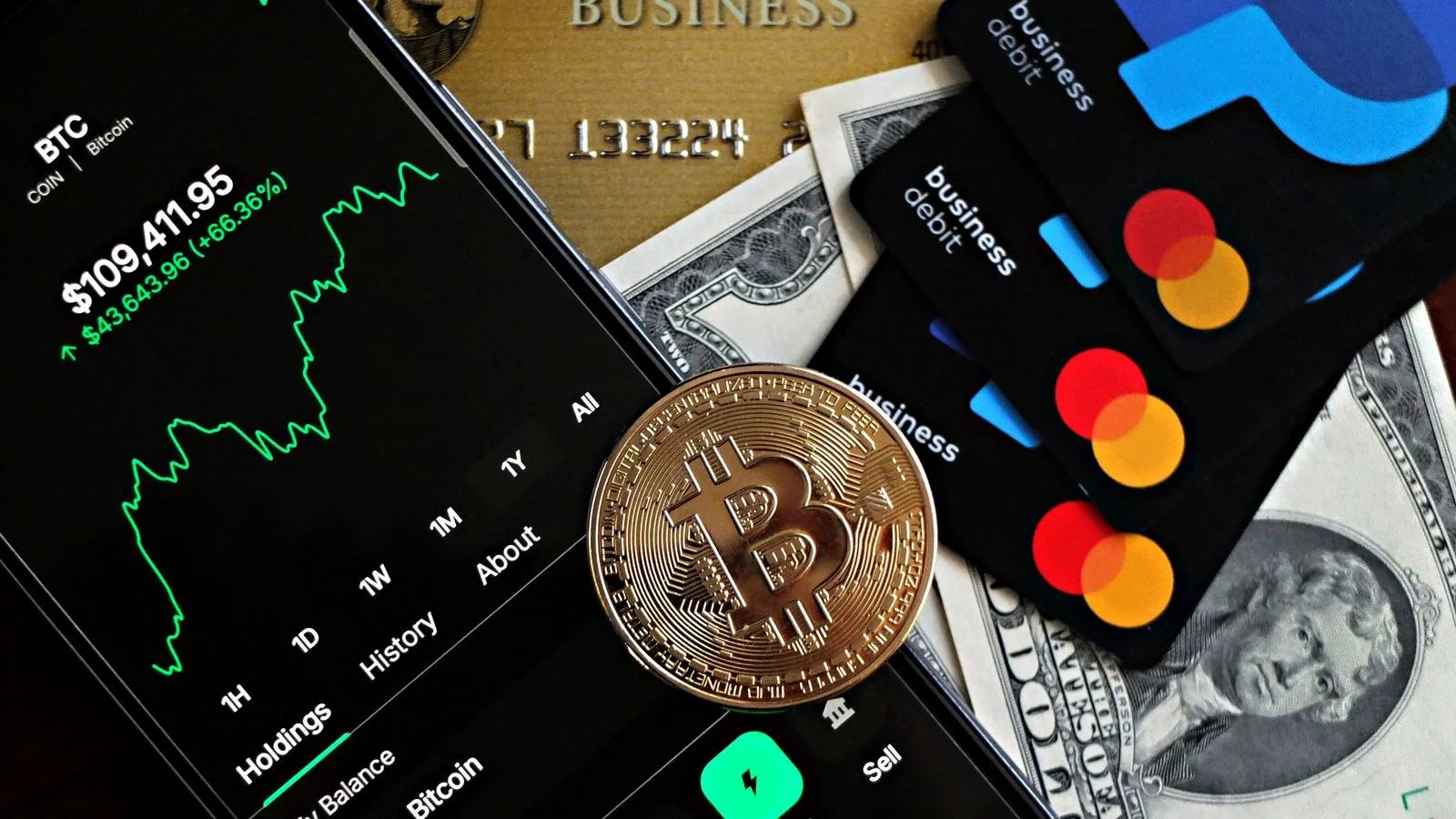A dynamic image showing Bitcoin, credit cards, and financial apps on a dark surface