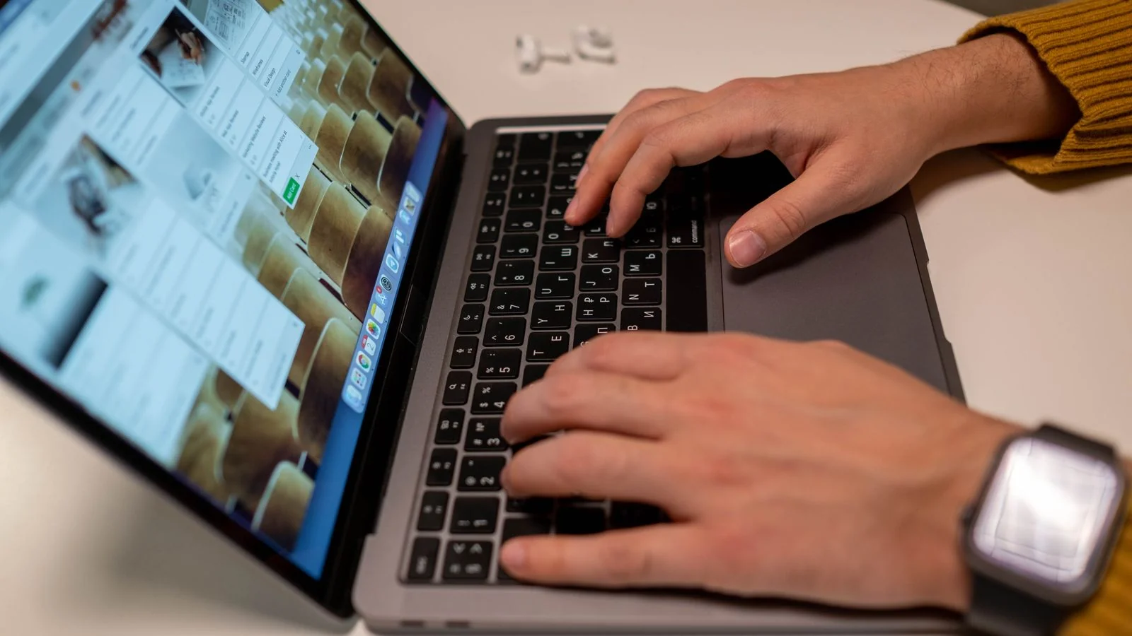 Hands typing a question into a laptop, the screen where clients now start their search.