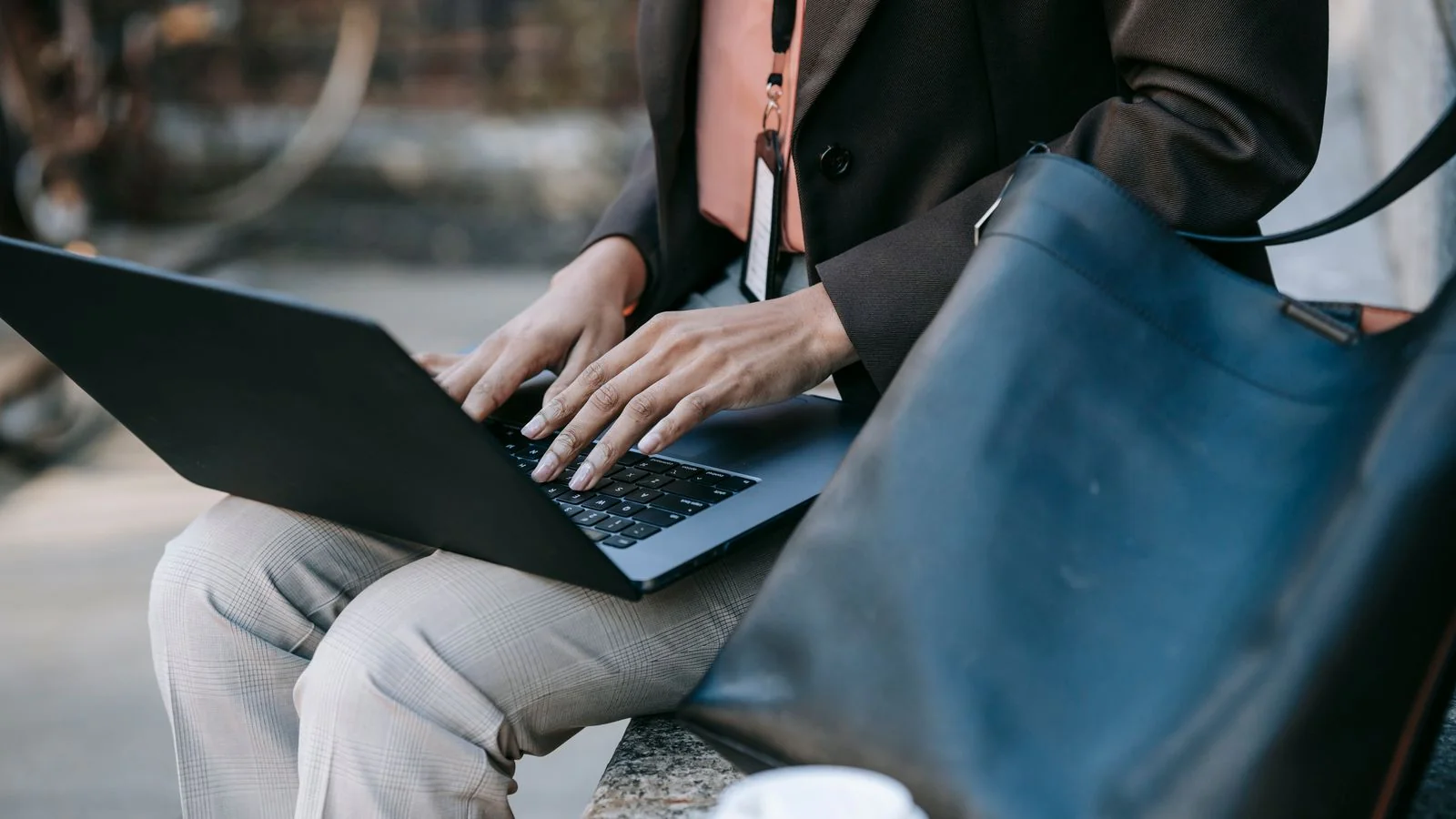 A person working at a laptop keyboard, the research phase that now happens inside an assistant
