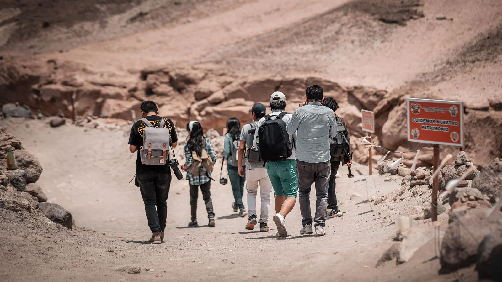 Hikers crossing arid terrain near Arequipa in Peru, a specific day on a specific route that most operators never describe in text.