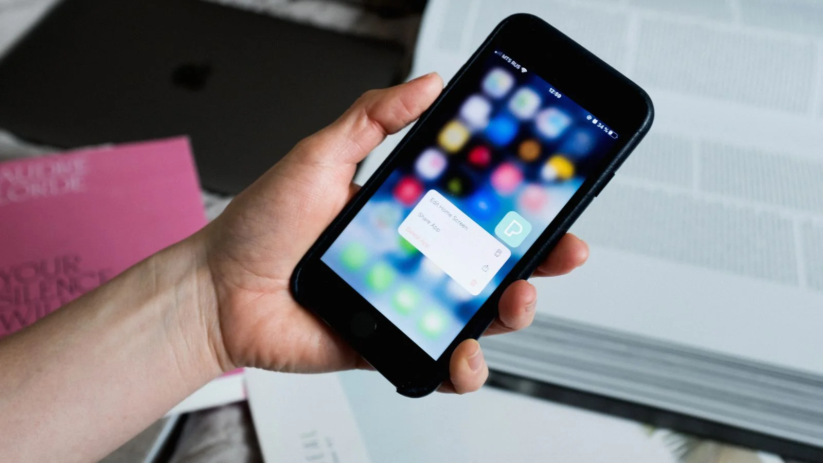 Close-up of a smartphone showing search results as a pet owner looks up a nearby vet