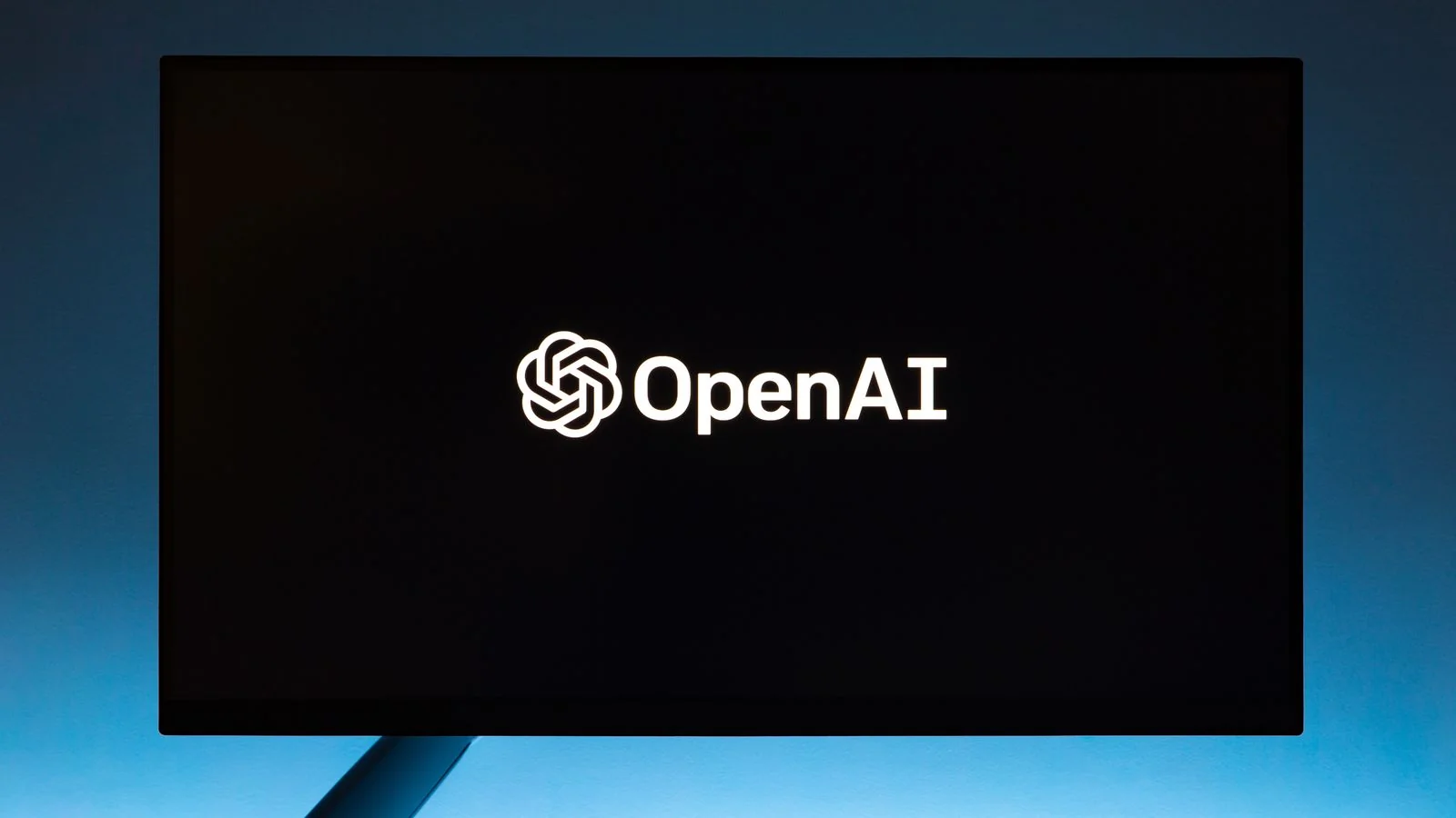 A monitor showing an AI assistant interface, synthesizing one answer instead of ranking a list of links