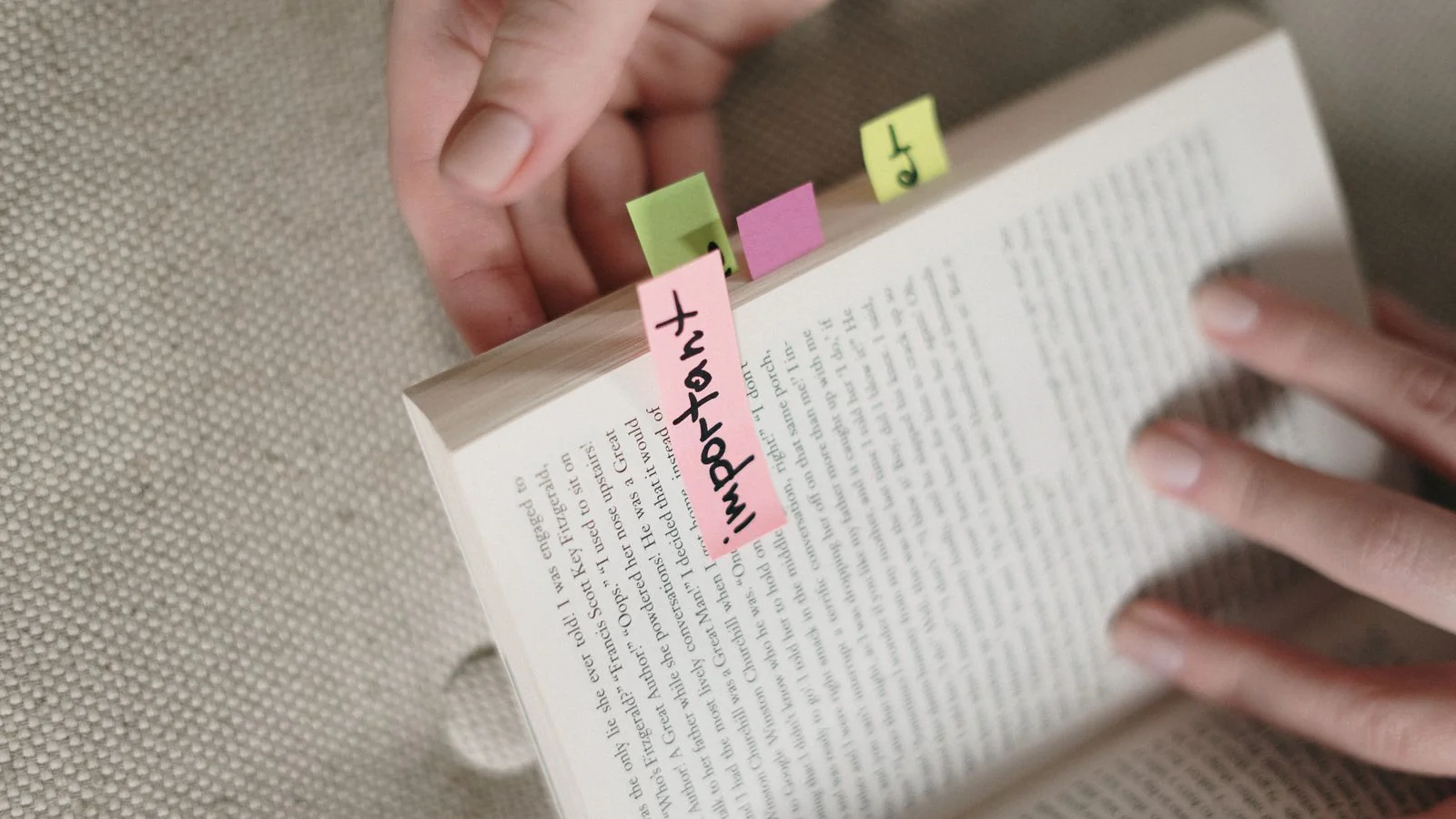 A book with colorful sticky notes marking key pages, like the sources an engine flags to cite