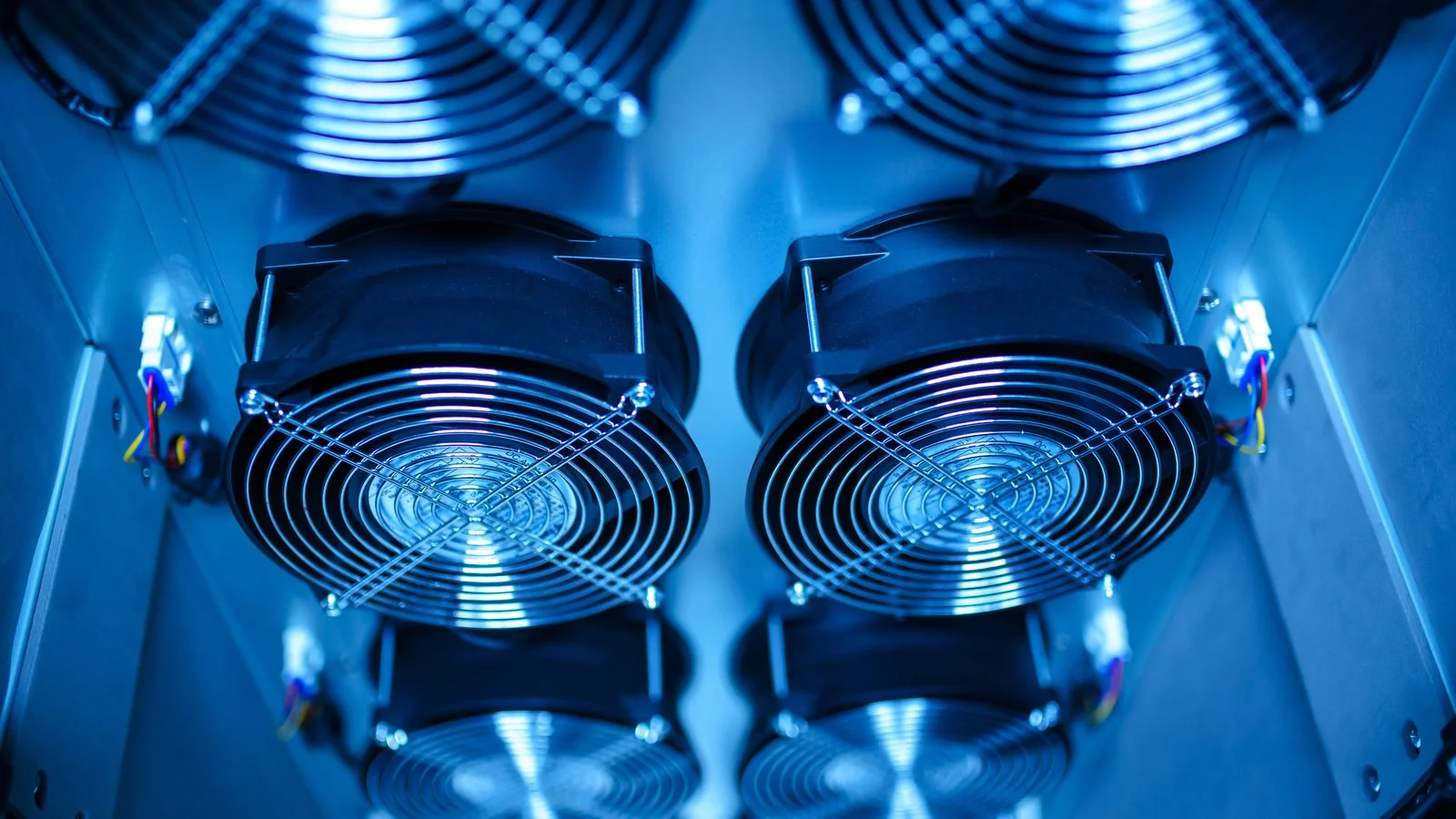Rows of server cooling fans, the infrastructure behind the flood of AI-generated web pages