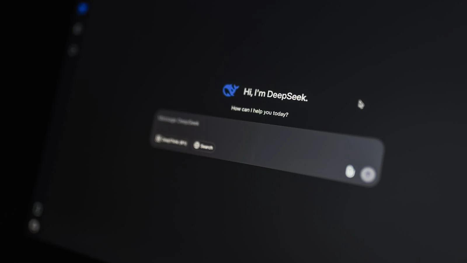 Dark monitor showing an AI chat interface mid-conversation, the kind of screen where podcast transcripts surface as cited sources