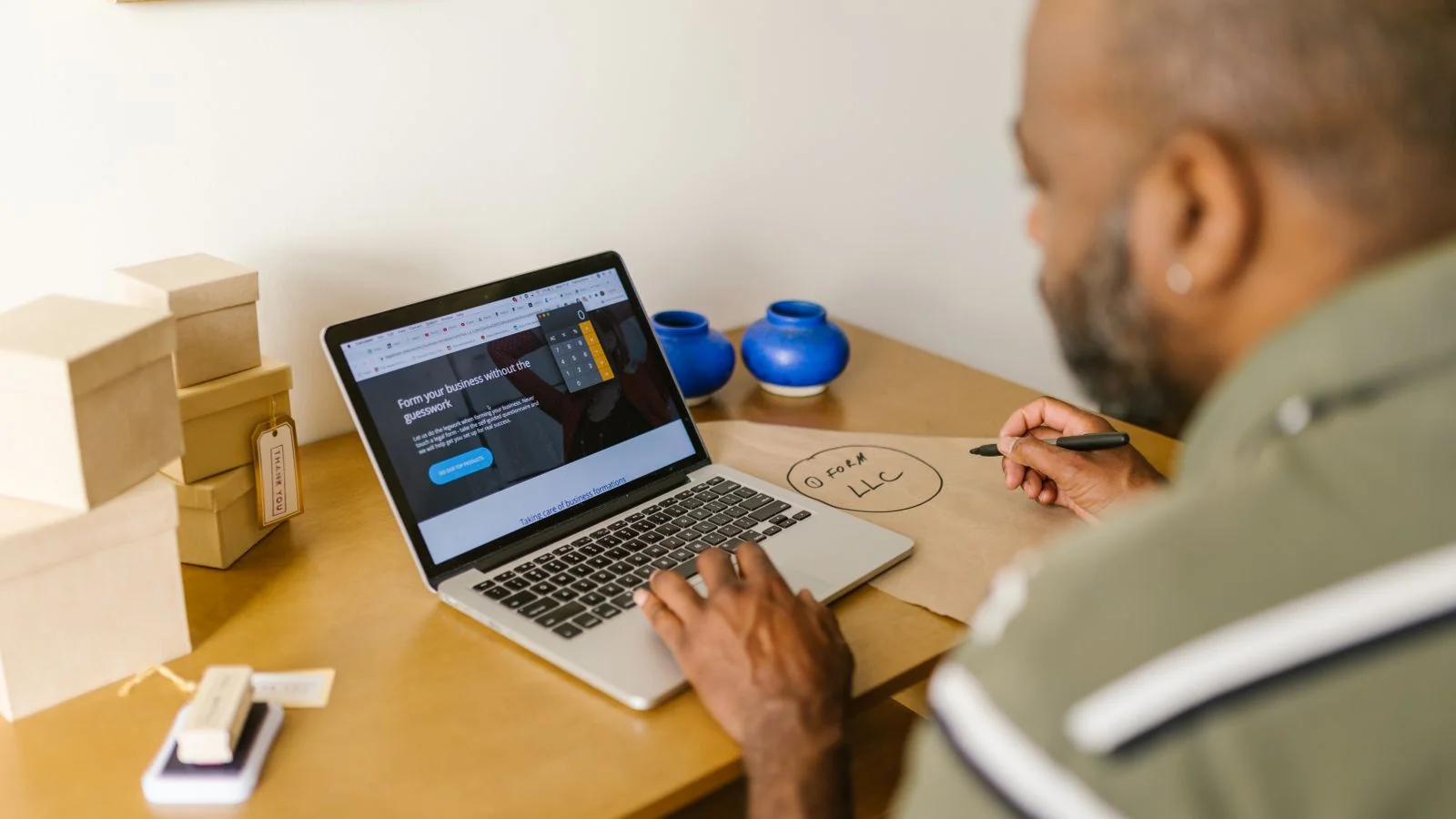 Entrepreneur working on a laptop at a desk while building an email sales funnel