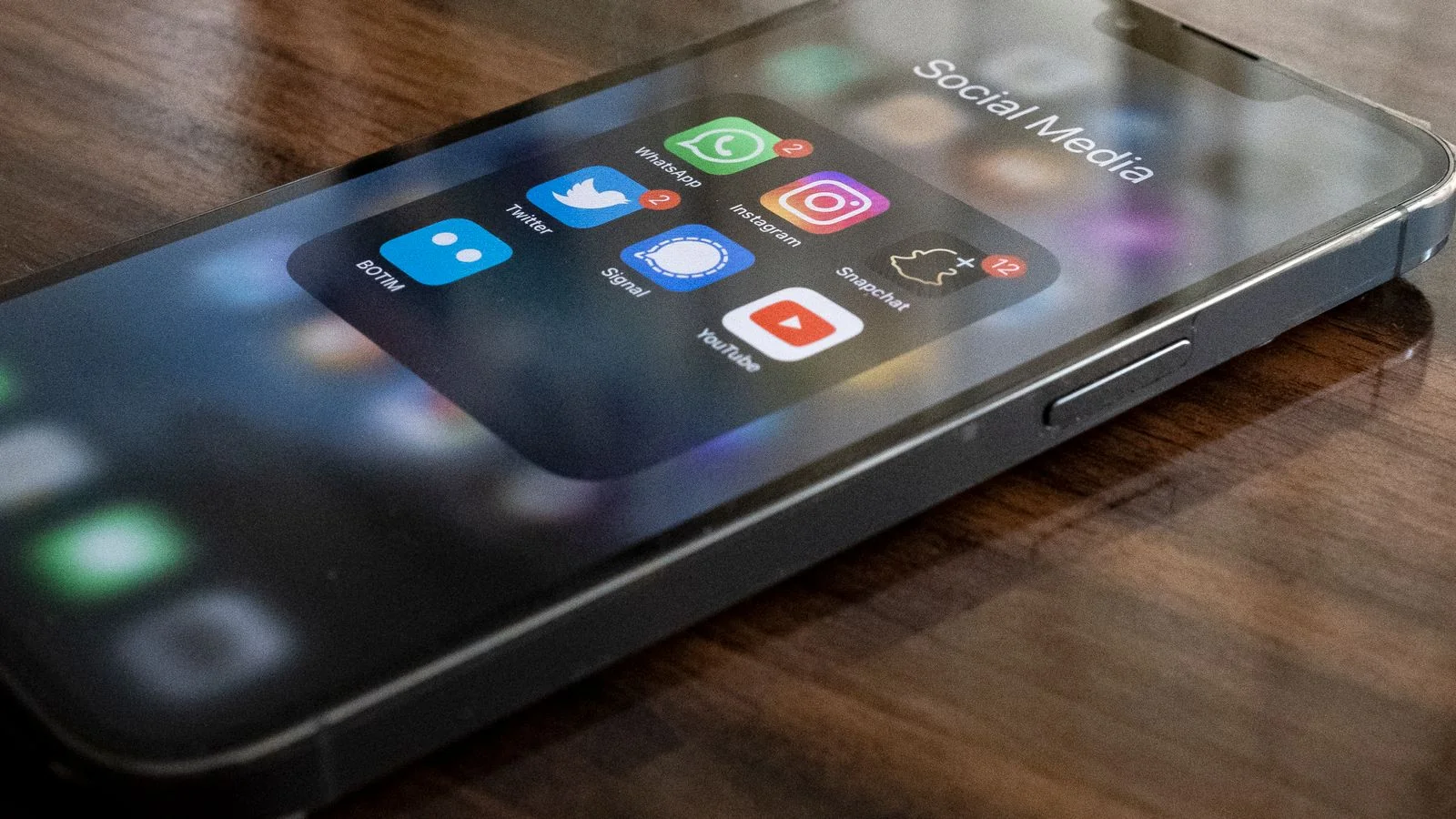 A person checking brand mentions across apps on a smartphone