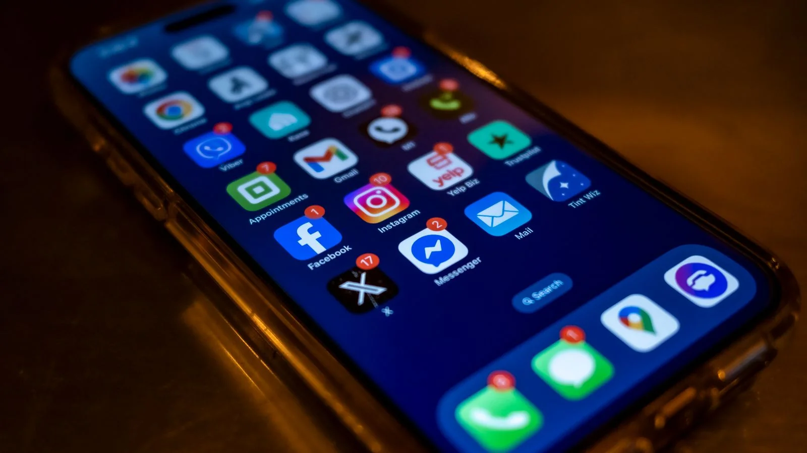 A person monitoring branded search results and mentions on a phone
