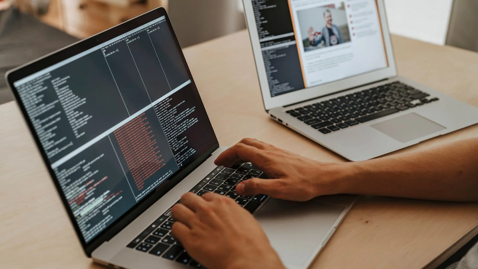 Developer typing code on a laptop, building the product before its beta goes public