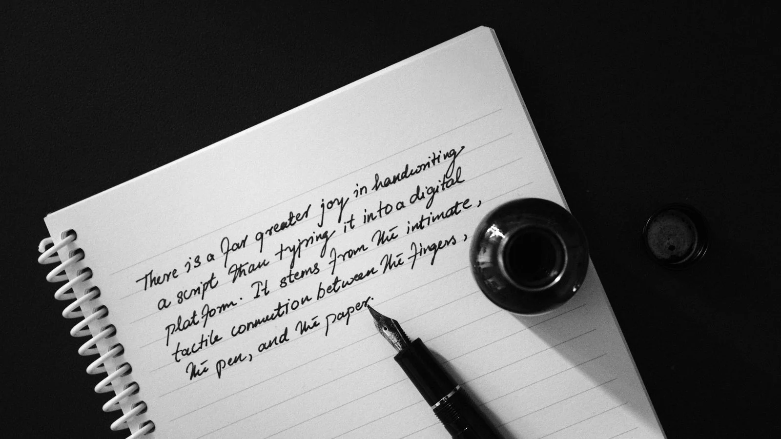 A fountain pen resting on an open notebook, the deliberate craft behind a high-performing blog post