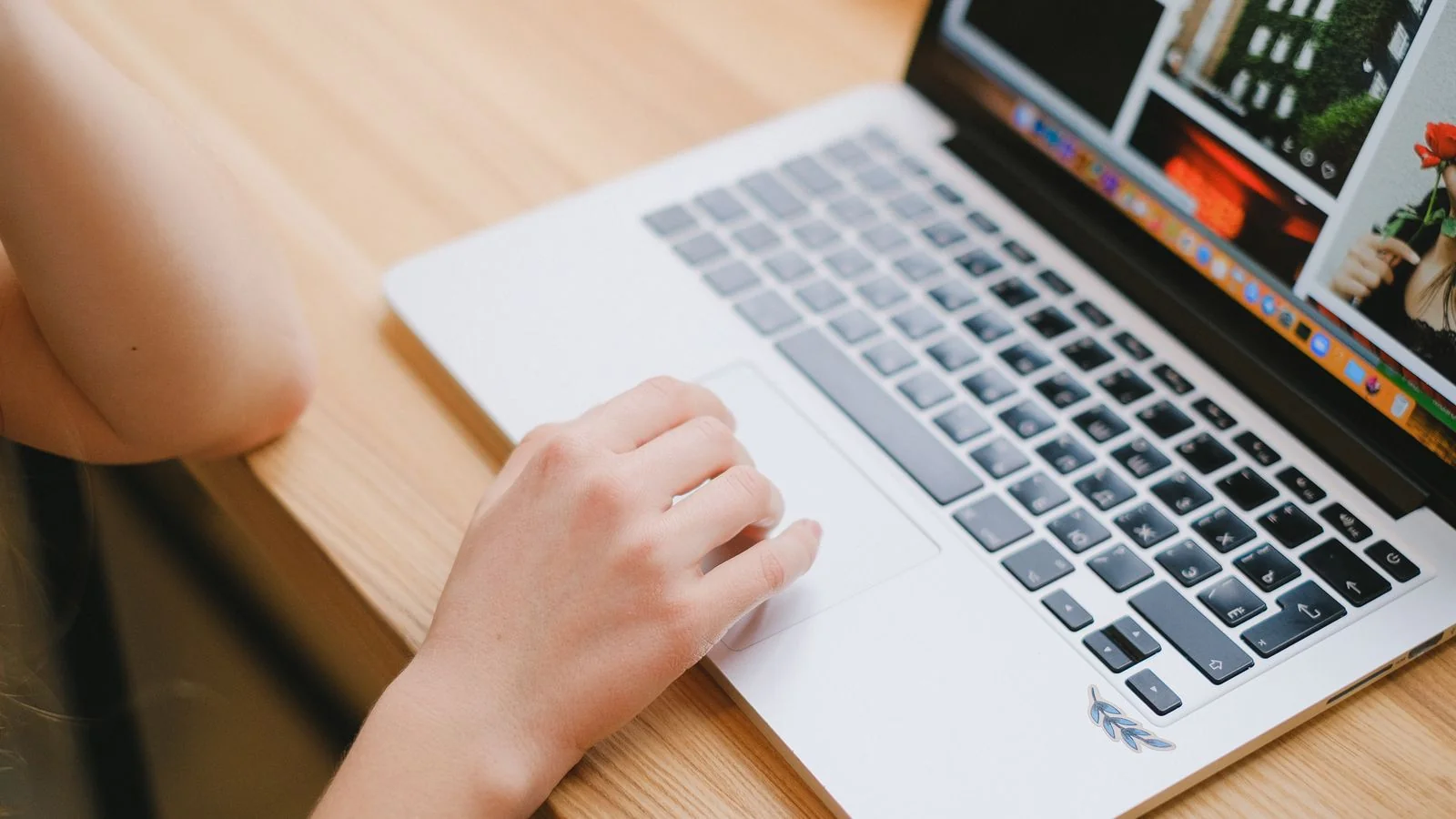 A person at a laptop researching, the credible third-party coverage that feeds AI mentions