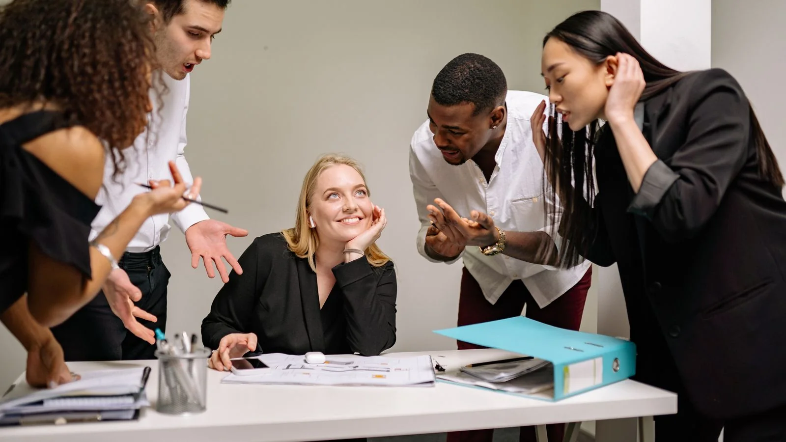 A group of professionals in animated discussion at work, the crisis review that exposes a short lookback window