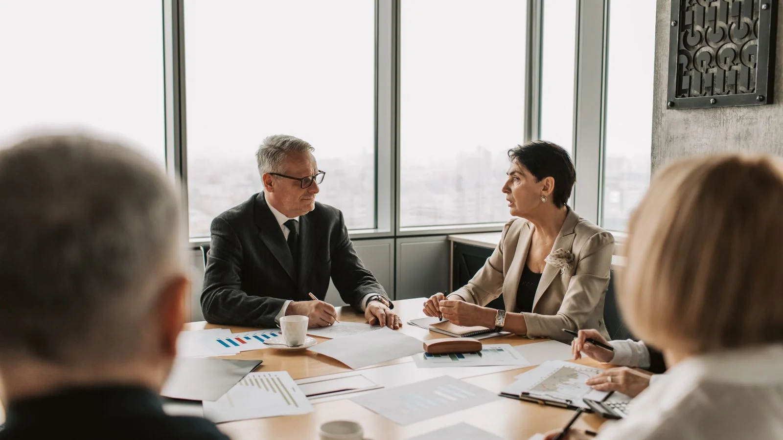 Executives in a strategy meeting in a modern office
