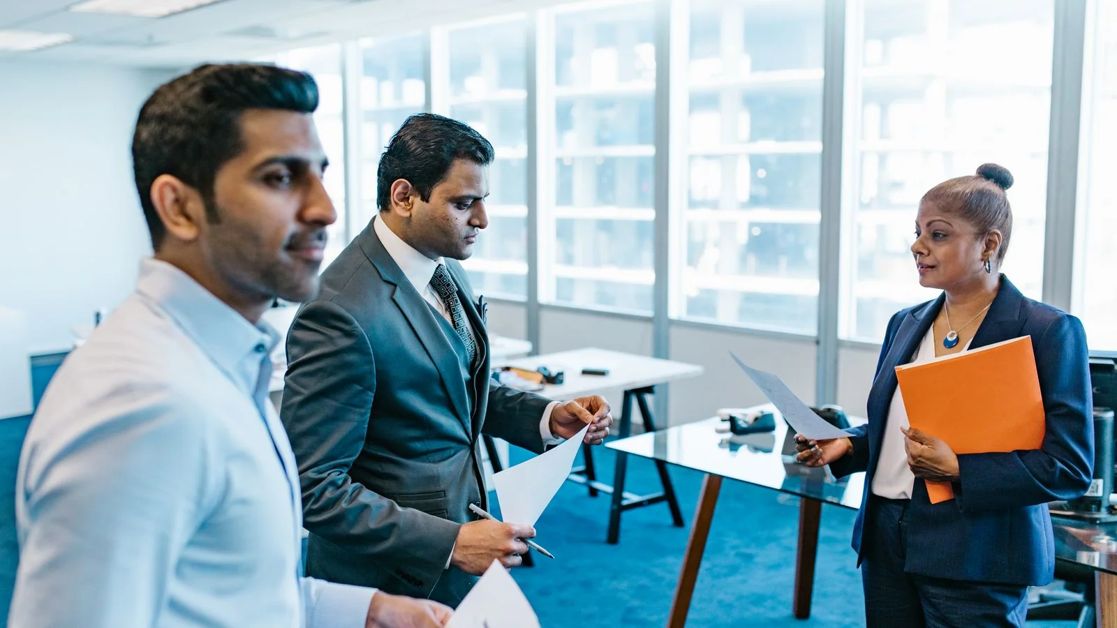 A team reviewing documents together, the analysis citation share replaces guesswork with
