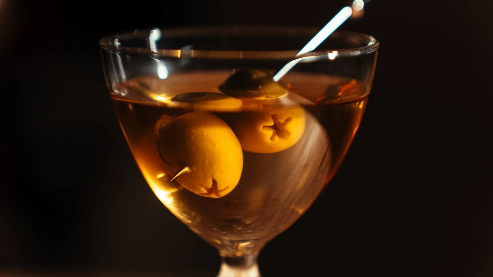 A finished cocktail styled and photographed on a bar.