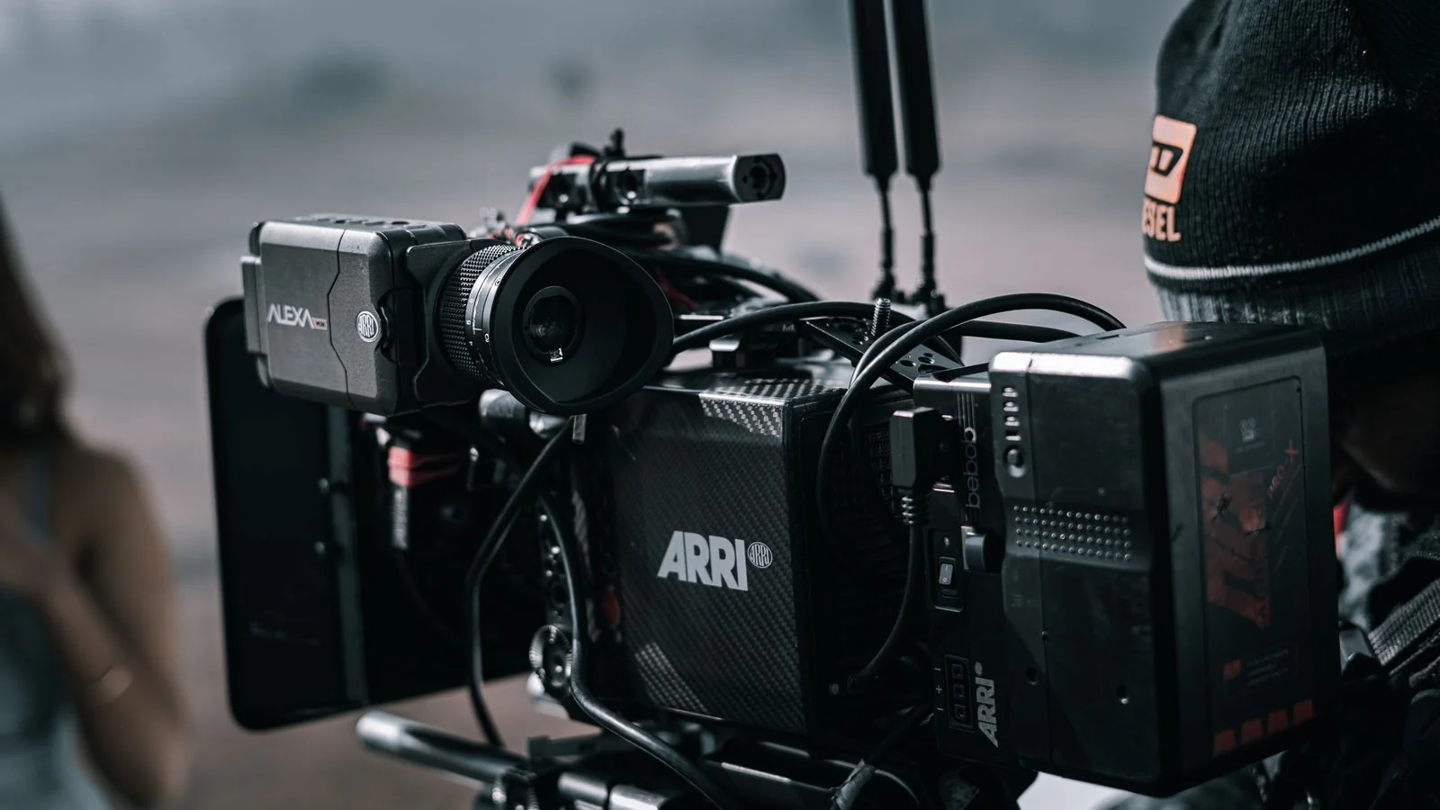 Professional video camera set up on an outdoor construction set, the tool that turns a job site into content.