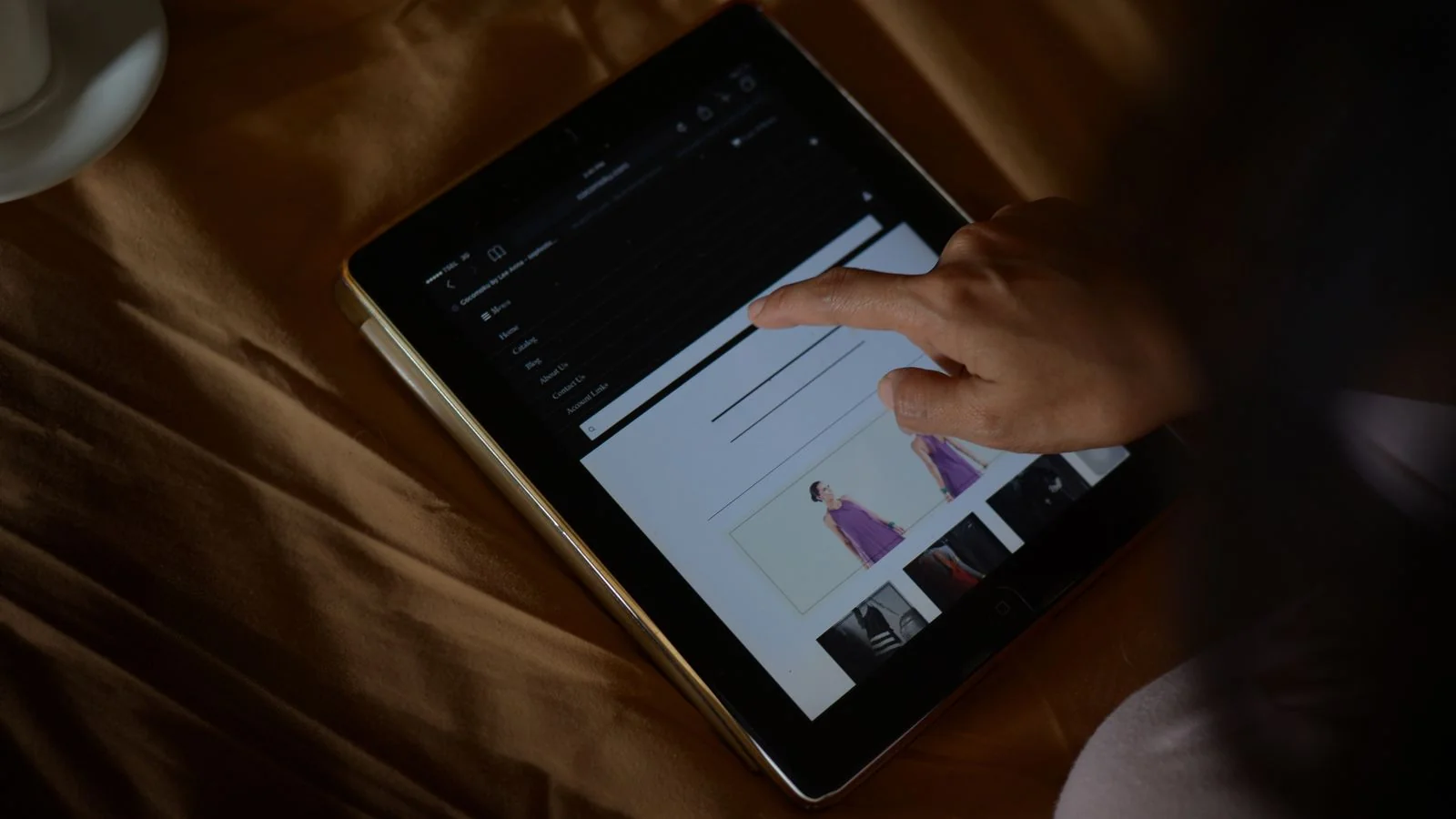 A woman browsing a website on a tablet, comparing options.