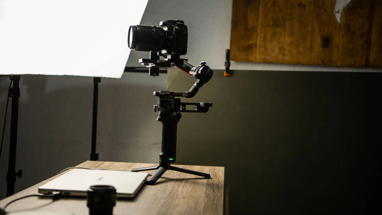 A camera and microphone set up on a desk for recording