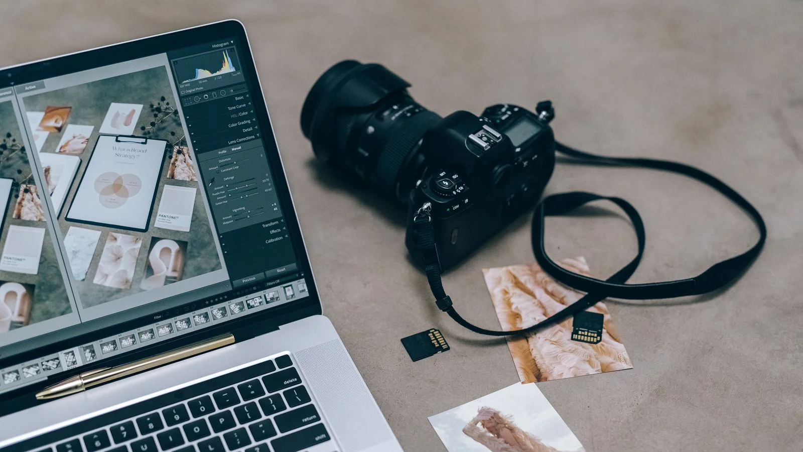 A laptop with editing software beside a camera and memory cards, where most venue content budgets end up.