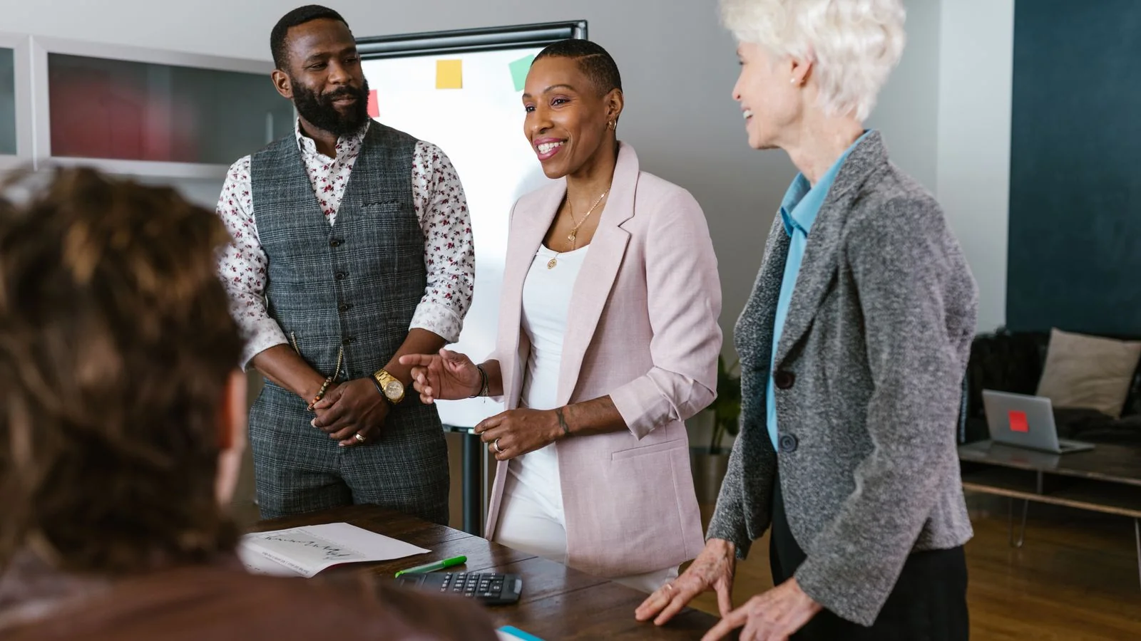 Business team in a strategy meeting in a modern office, aligning company facts across platforms