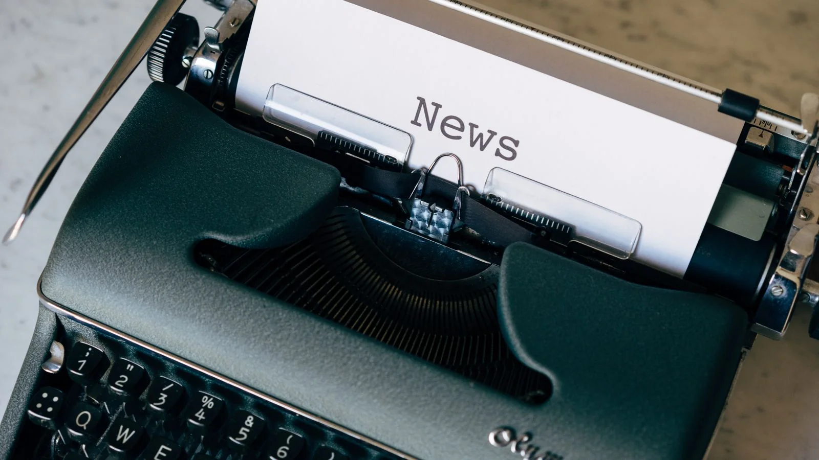 A vintage typewriter with a sheet of paper reading News, standing in for the old print-and-broadcast era of PR