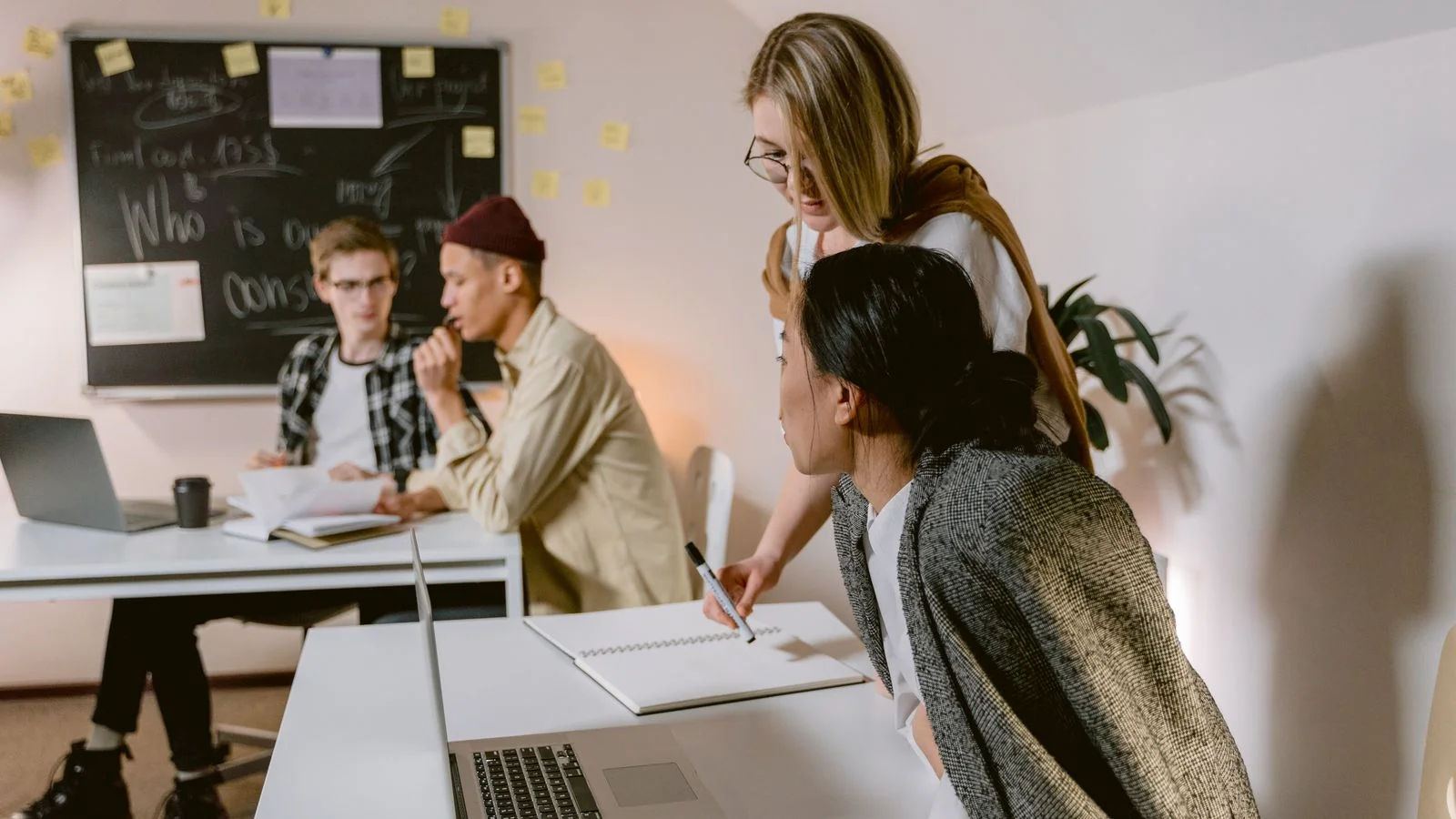 A group of professionals in a brainstorming session in a modern office