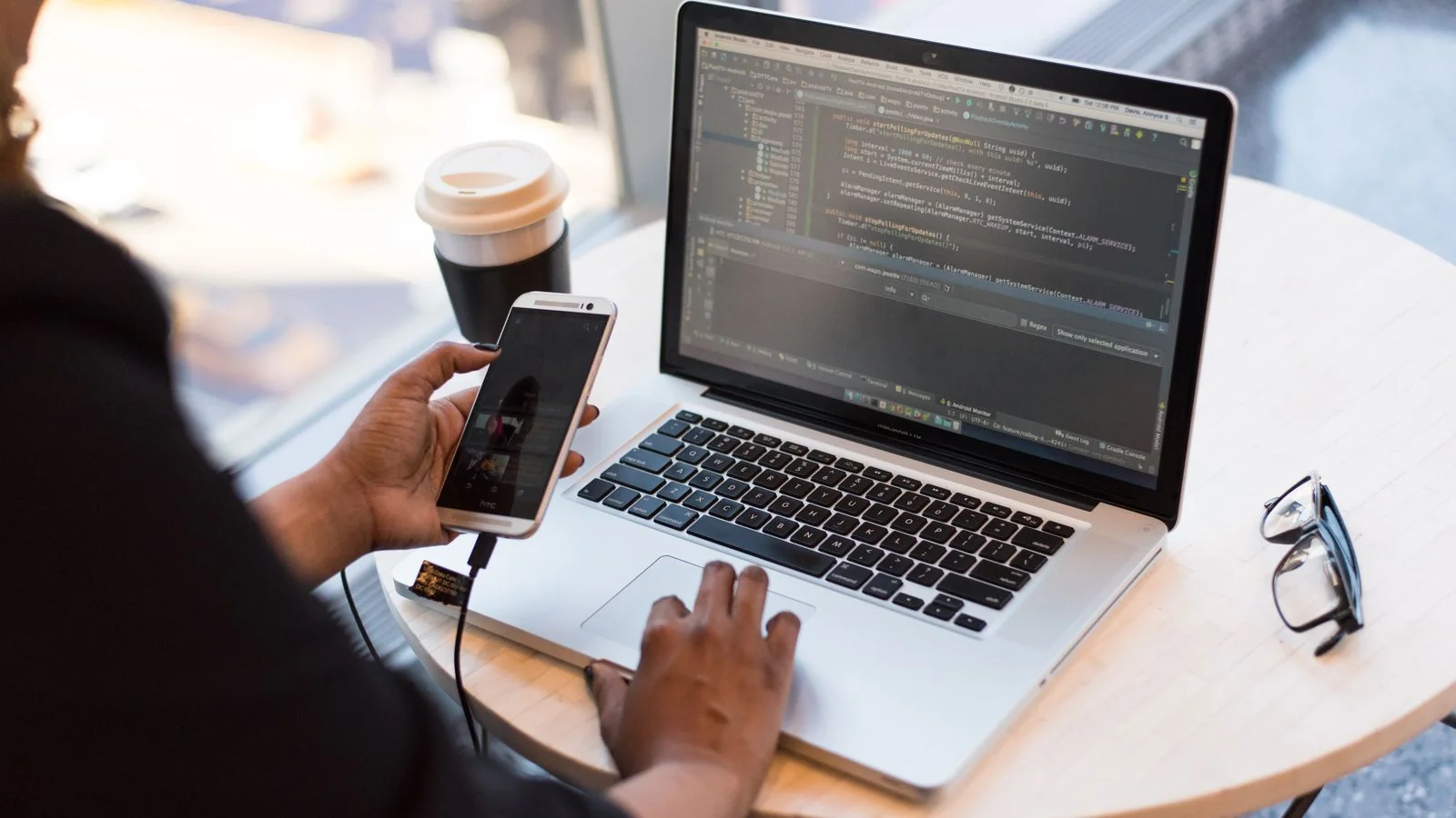 A person reviewing analytics for a published article on a laptop screen
