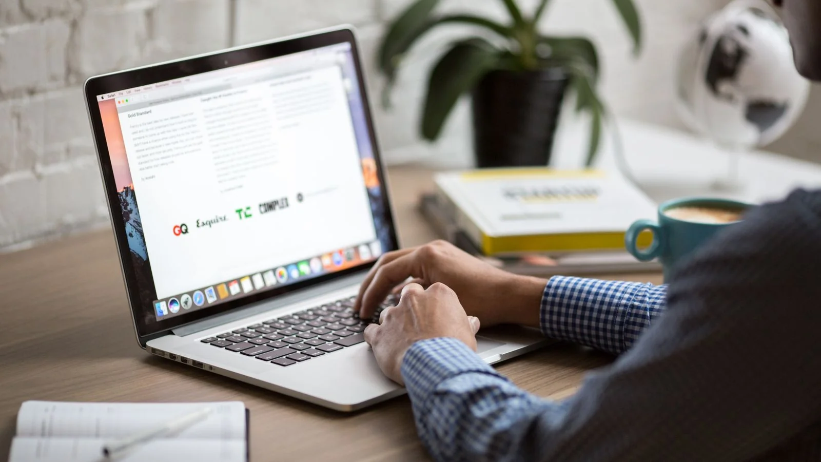 A man working on a laptop with coffee, setting up the first opt-in form for a new list