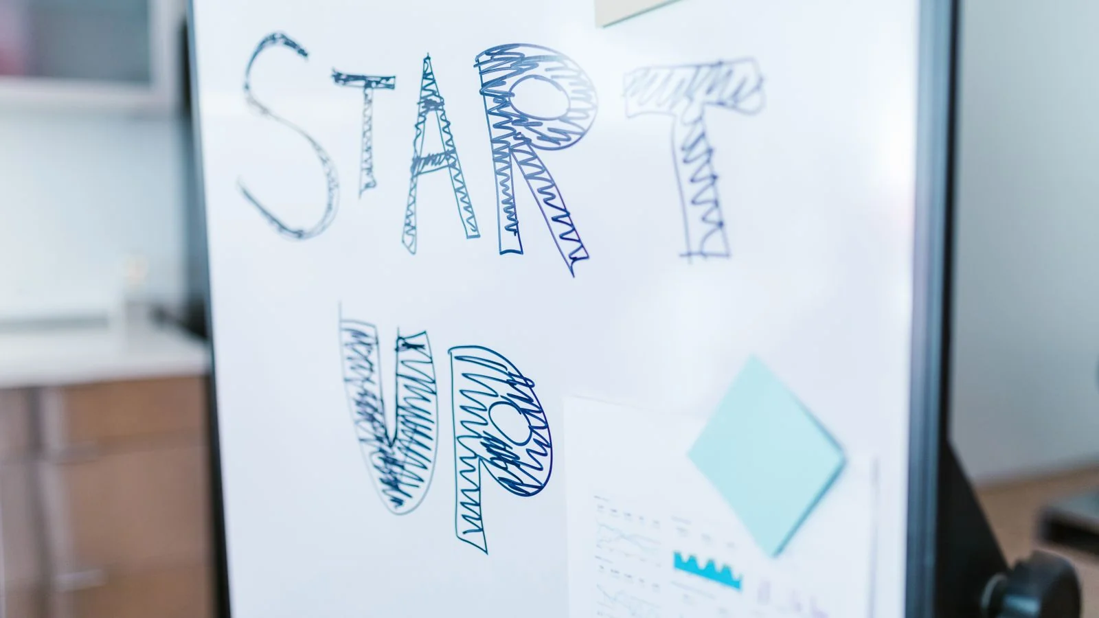 Startup concept handwritten on a whiteboard, illustrating the rise of solo founders