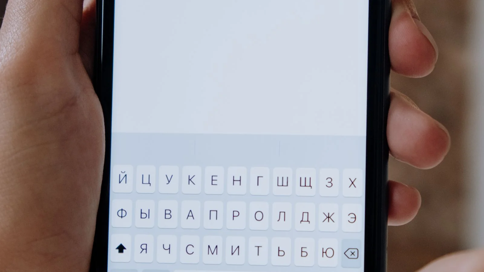 Hands holding a smartphone with a search interface, each turn a fresh decision about who to cite
