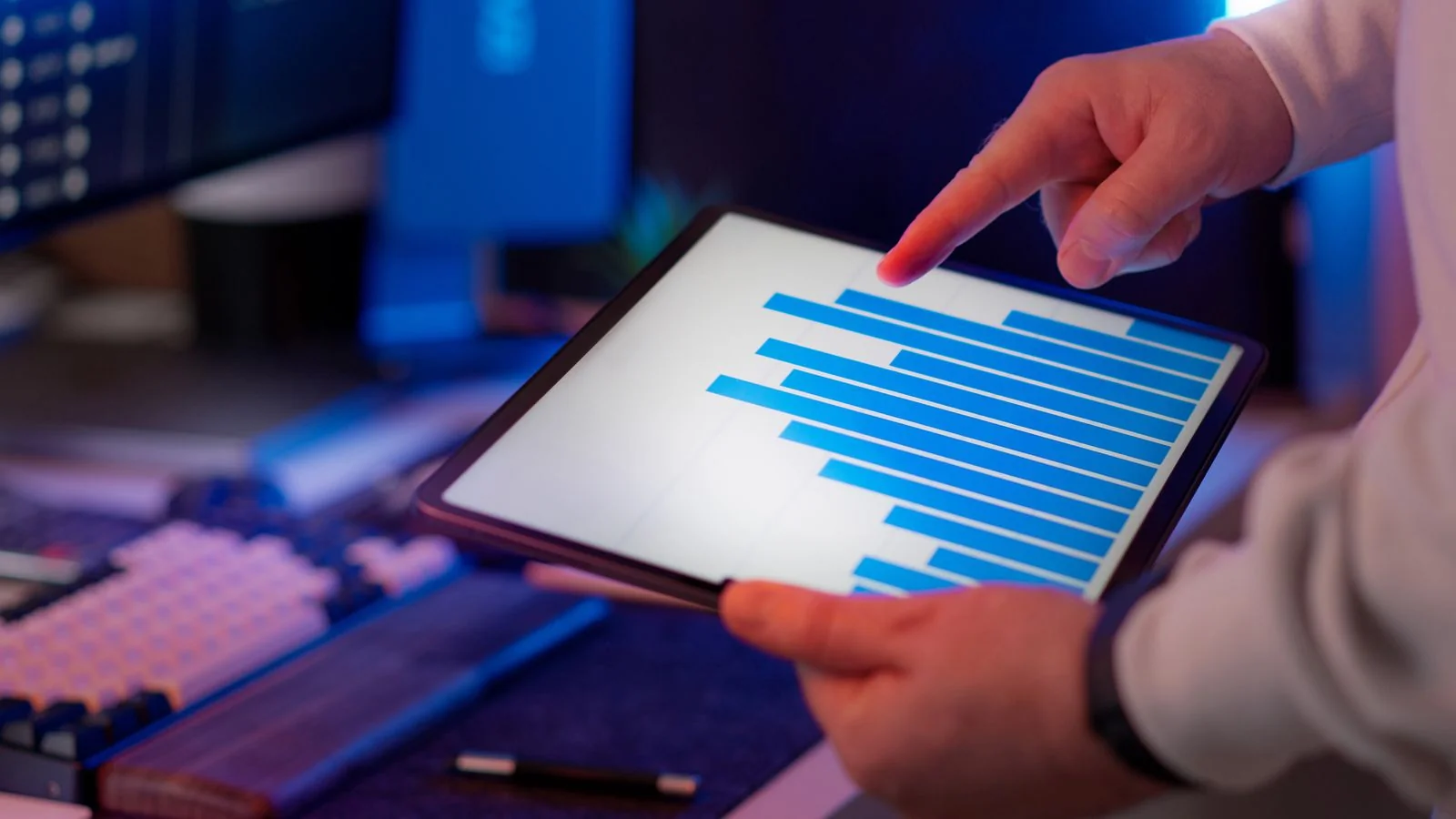 A businessperson analyzing data on a tablet, the traditional authority Gemini inherits straight from Google