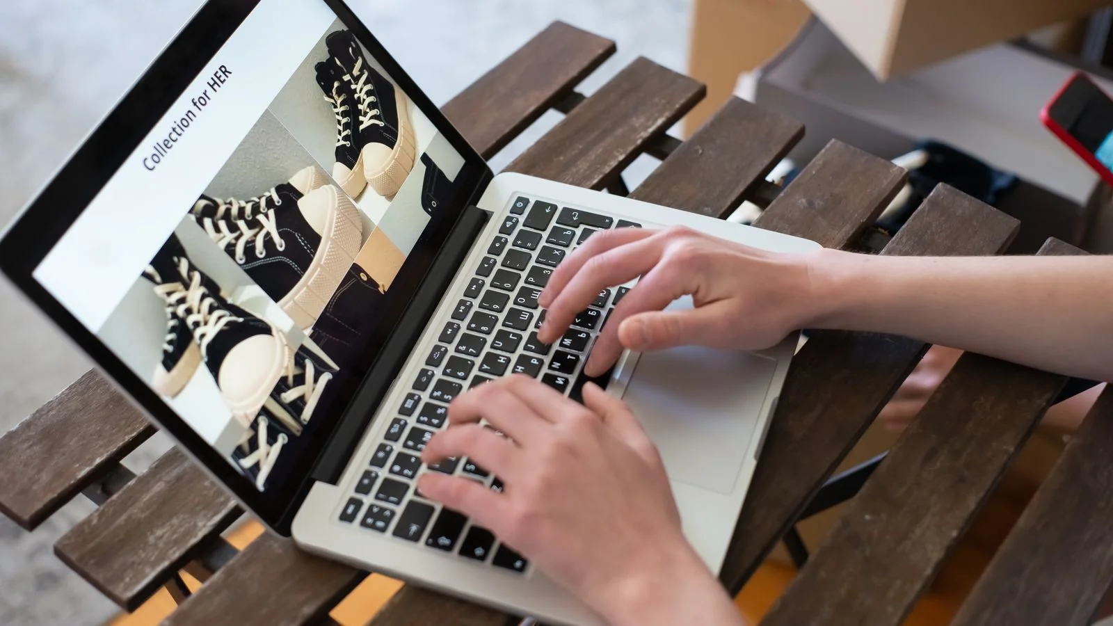 Hands browsing an online store on a laptop, the same search surface where clients first form an impression of you