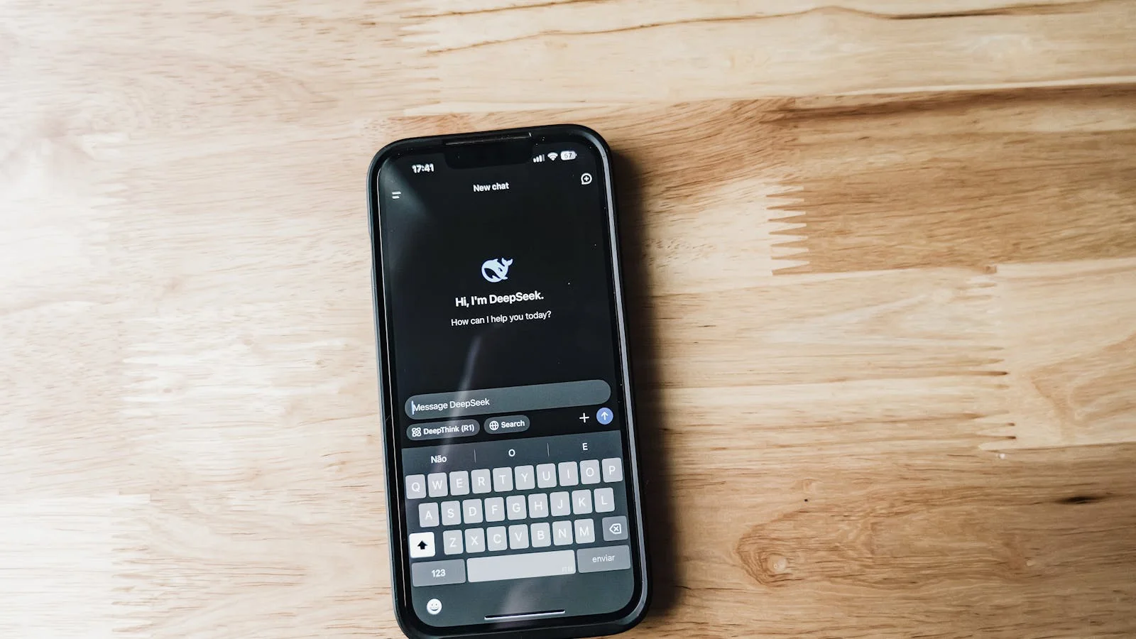 Smartphone displaying AI chat interface on a wooden table mid-conversation about how-to instructions