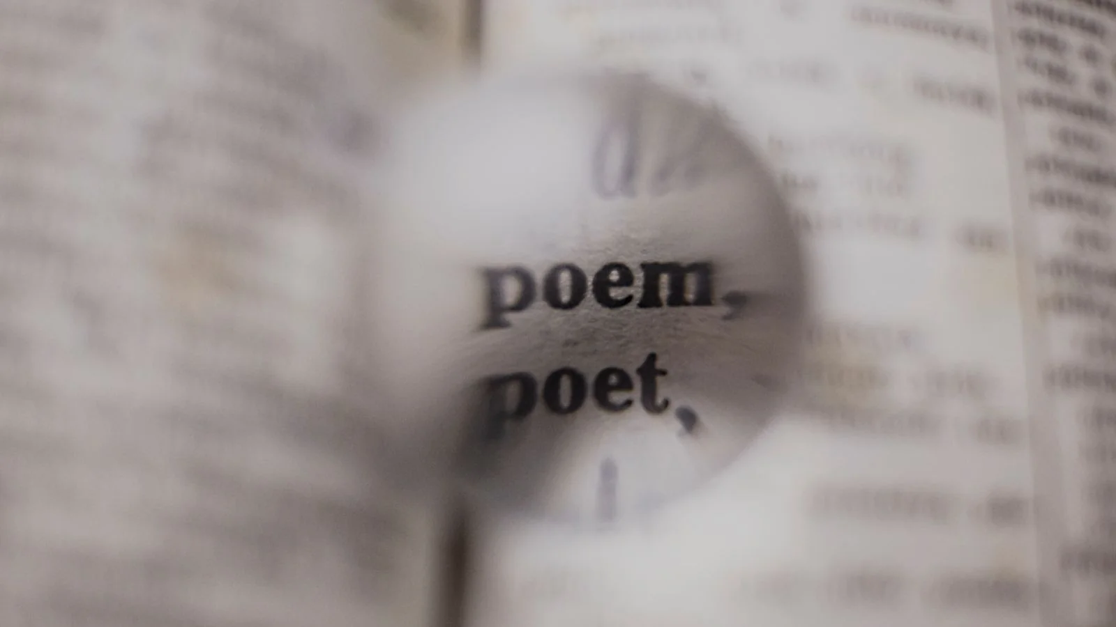 The words 'poem' and 'poet' magnified in a dictionary, standing in for the precision Claude rewards in a citable passage