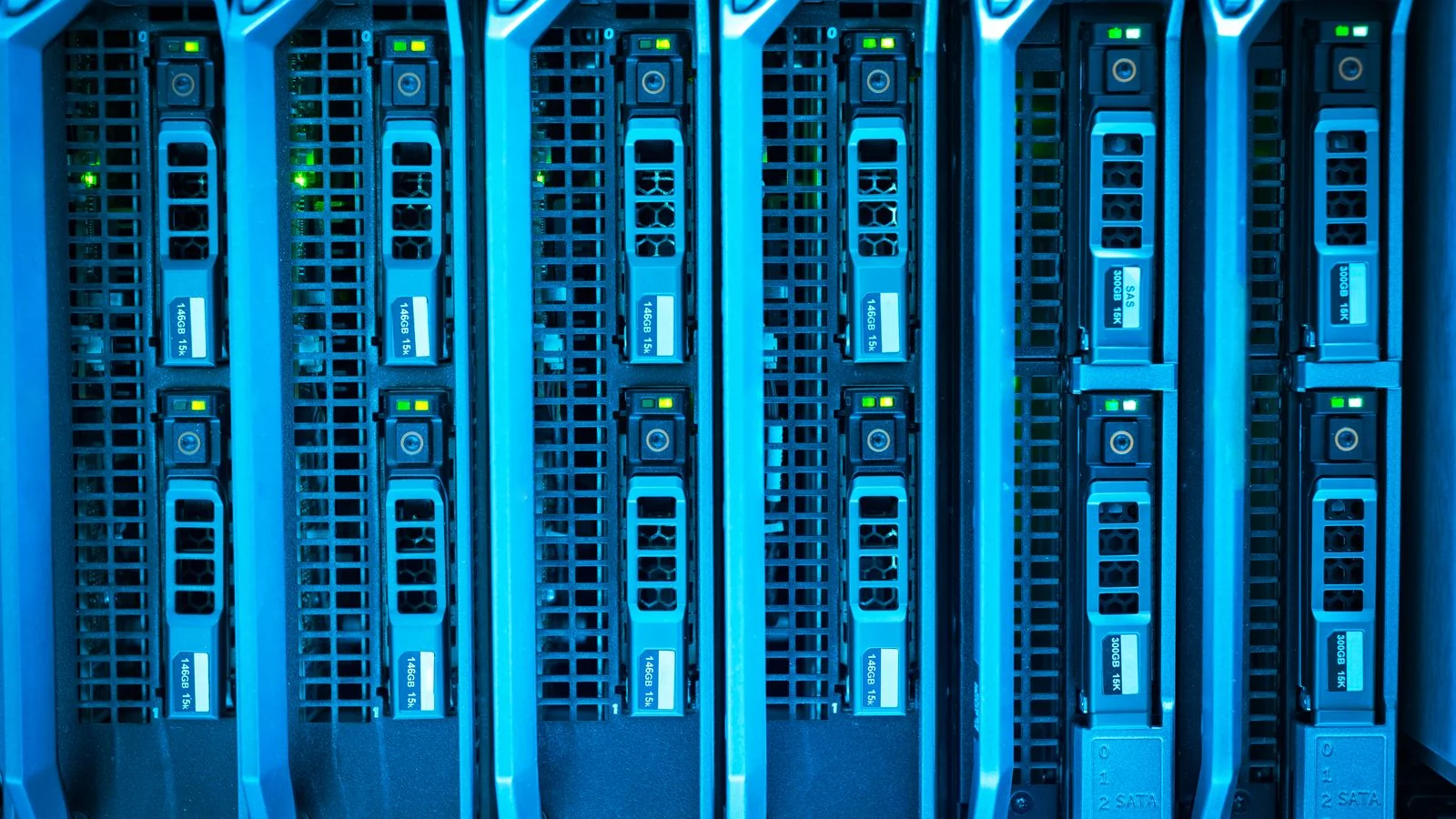 Illuminated server racks in a data center, the infrastructure behind how AI Overviews are assembled in real time