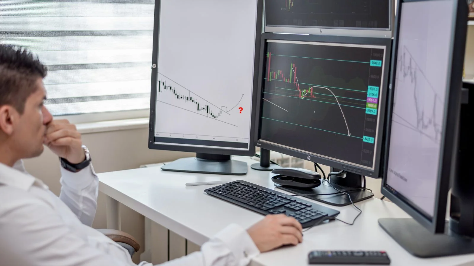 A professional analyzing data across multiple monitors, comparing which source earns the citation
