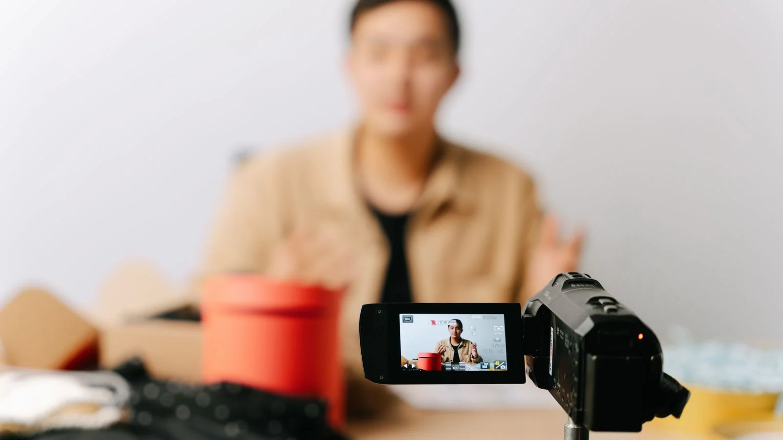 A creator filming video content, turning a single idea into multiple formats across a content flywheel