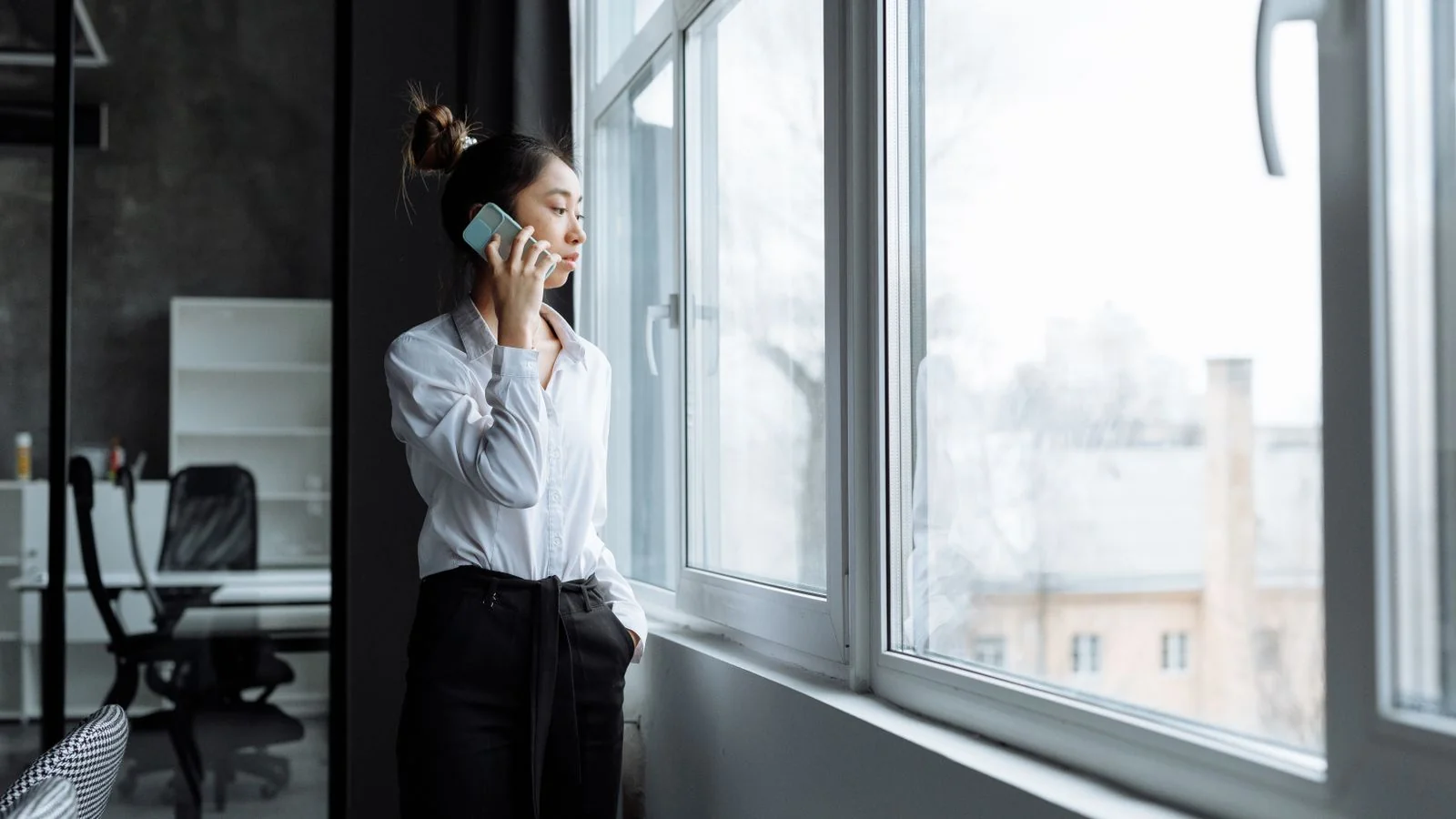 Founder on a phone call pitching a story from a home office