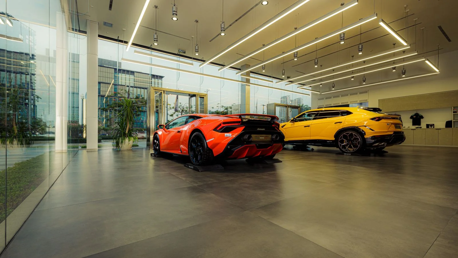 Luxury sports cars displayed in a sleek modern showroom