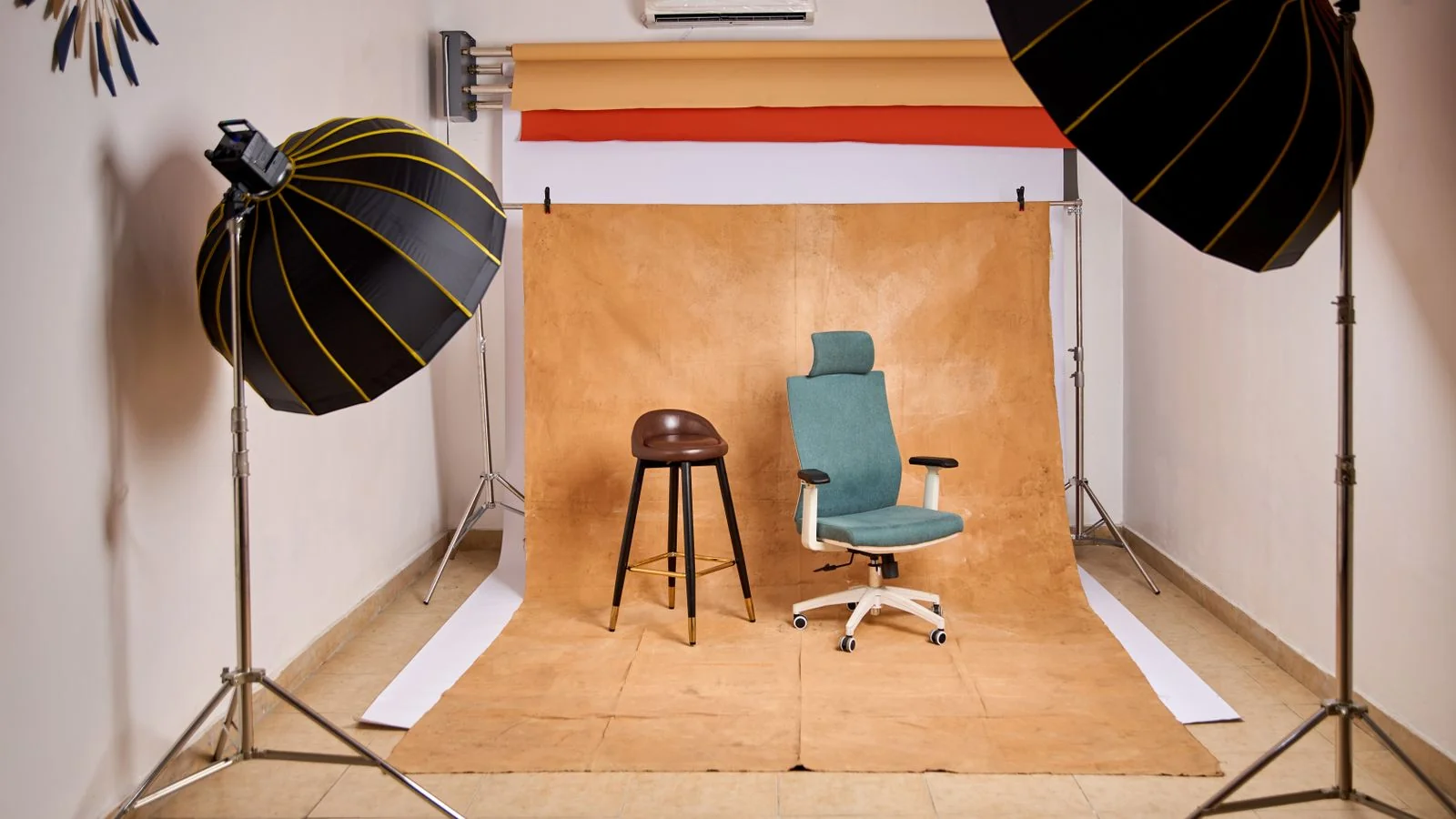 Photo studio set with lighting rigs and chairs, where interior projects earn their photography score