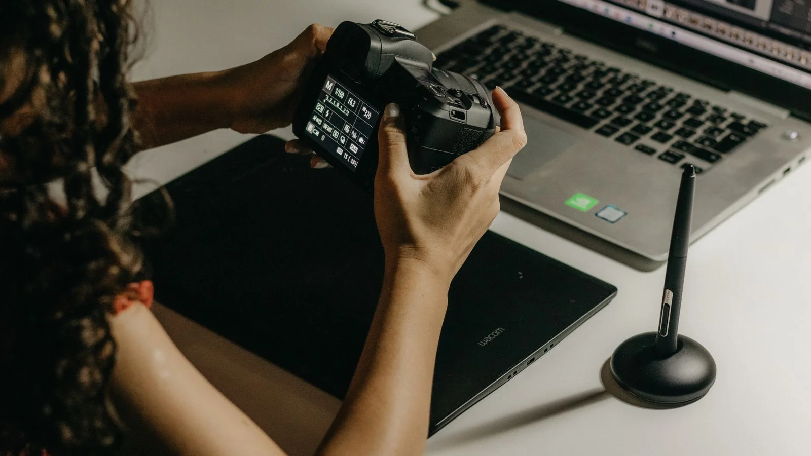 Editor reviewing and selecting images and copy at a desk