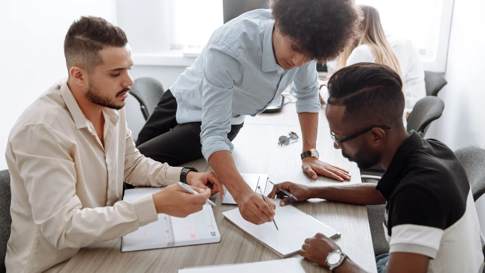 A small diverse team collaborating in a modern office