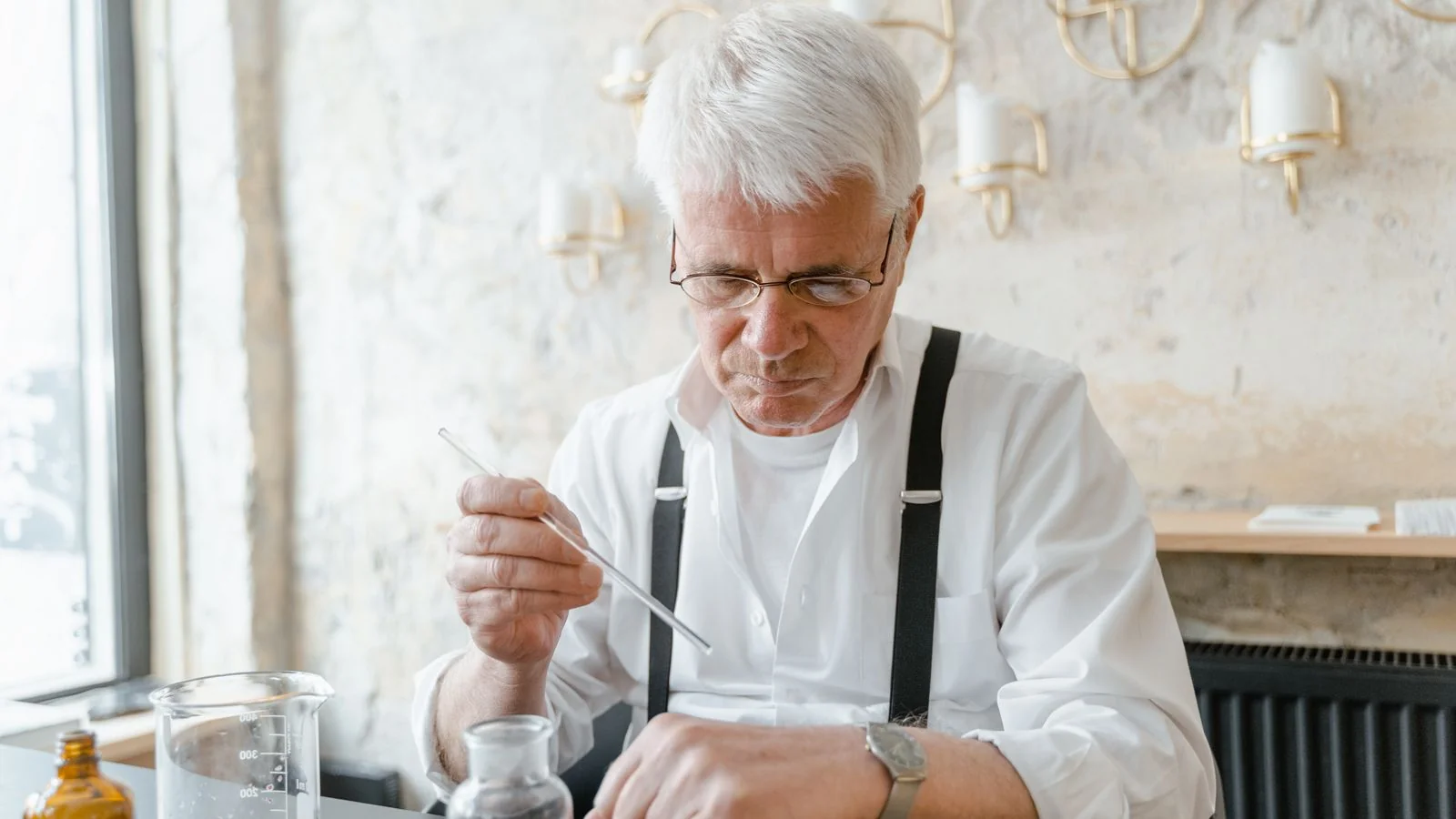 Lab technician testing fragrance samples in a modern laboratory