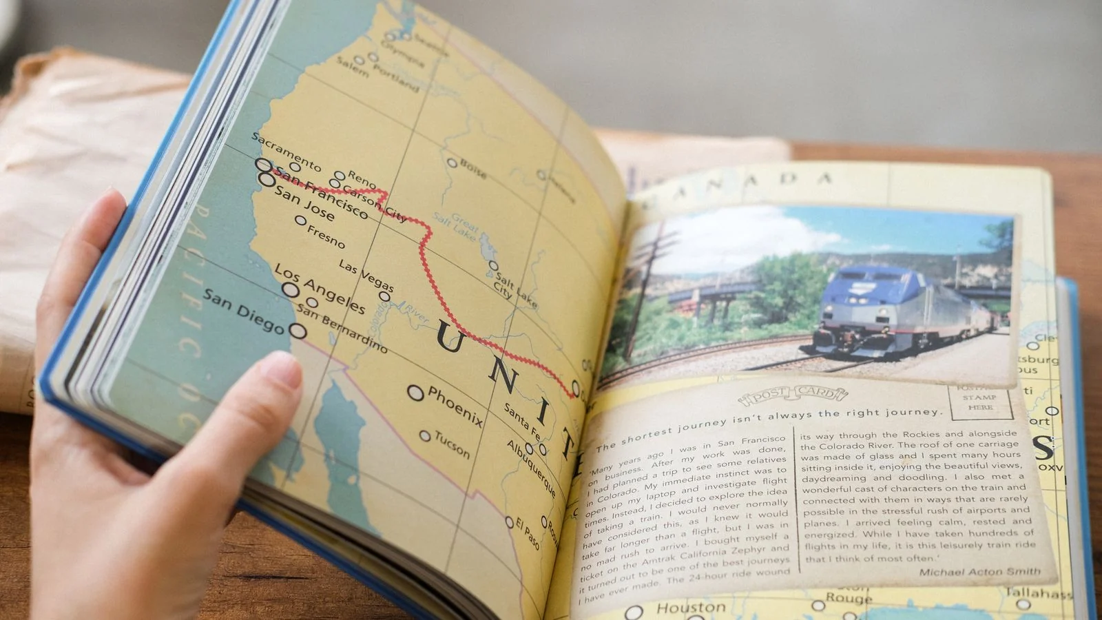Open guidebook page showing a USA map of West Coast train routes beside a photo of a train