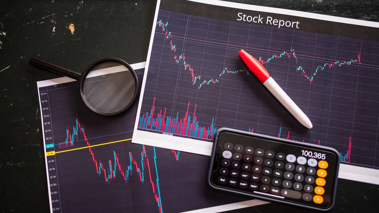 Stock report with charts, calculator and magnifying glass, the market data a timely MarketWatch pitch attaches to