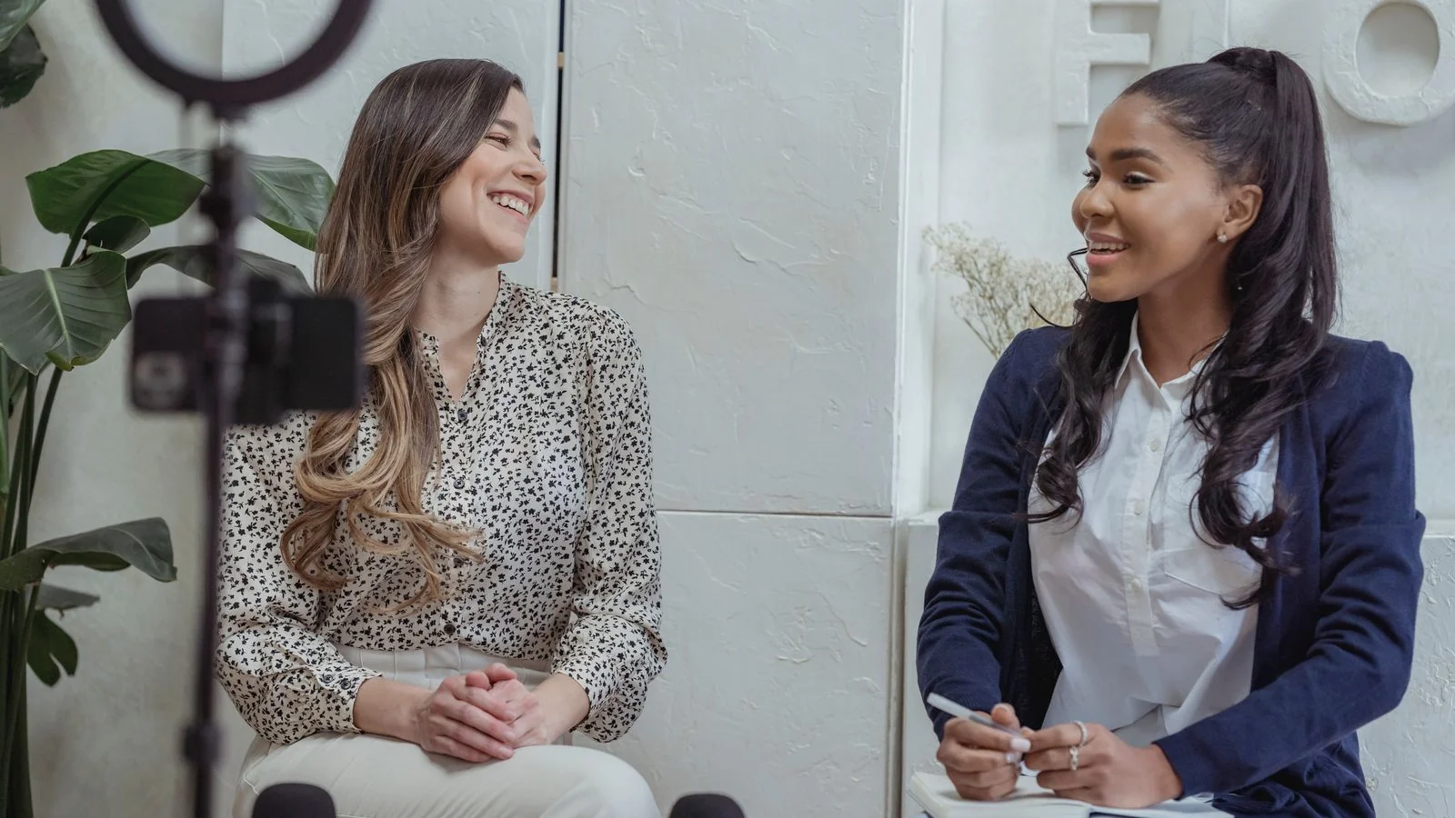 Two people in conversation during an interview, telling a personal story.