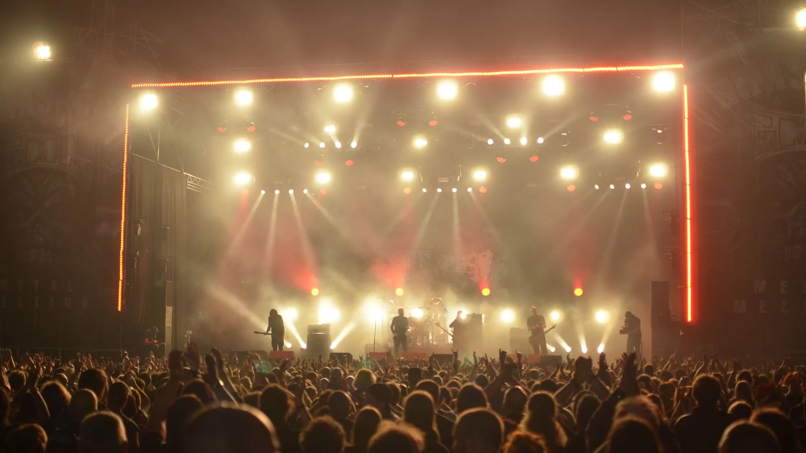 A band performing on a lit stage, the cultural moment Rolling Stone wants to capture through a person